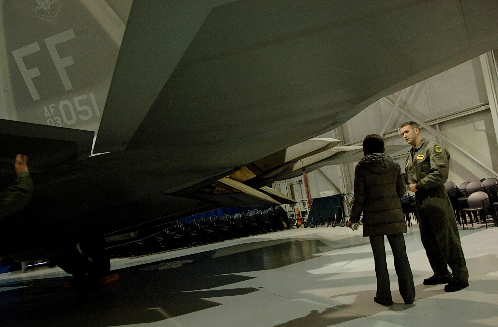 Capt. Phil Colomy explains F-22 Raptor capabilities to reporter Aya Igarashi during a press conference Jan. 31 at Langley Air Force Base, Va. Captain Colomy is an F-22 pilot with the 27th Fighter Squadron. (U.S. Air Force photo/Staff Sgt. Samuel Rogers)