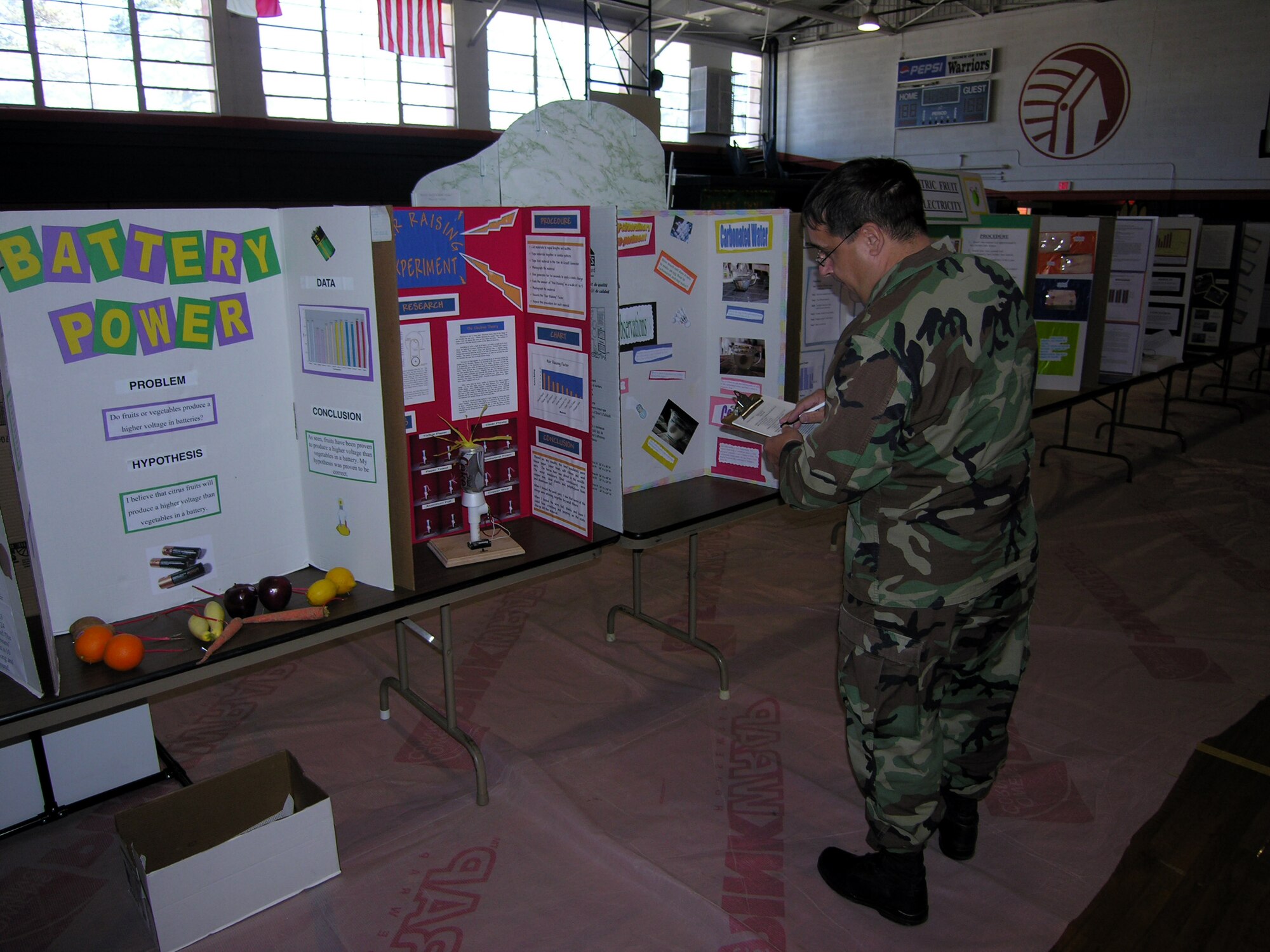 Col. Paul Weimer, 916th Air Refueling Wing Maintenance Group commander, judged science fair projects at Eastern Wayne Middle School on Monday, January 29. Col. Weimer, along with Command Chief Lester Boltinhouse and Lt. Col. Eric Jorgensen, plans, judged more than 300 entries of middle school students as part of a community outreach.
          