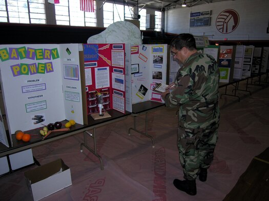 Col. Paul Weimer, 916th Air Refueling Wing Maintenance Group commander, judged science fair projects at Eastern Wayne Middle School on Monday, January 29. Col. Weimer, along with Command Chief Lester Boltinhouse and Lt. Col. Eric Jorgensen, plans, judged more than 300 entries of middle school students as part of a community outreach.
          