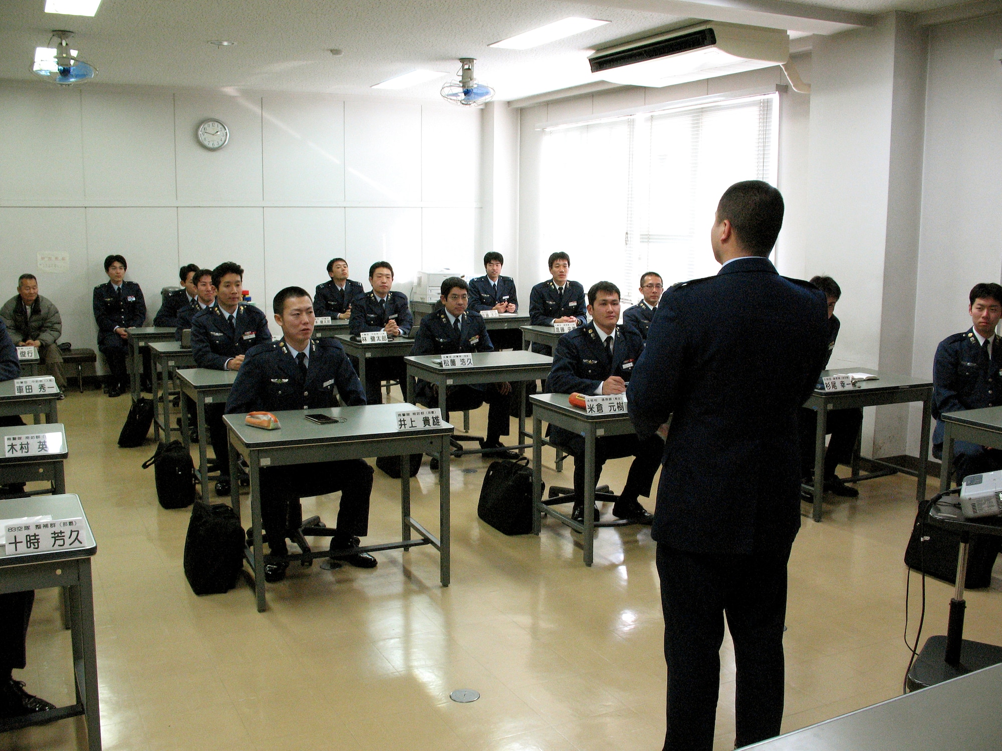 Capt. Joseph Cook teaches English and offers an introduction to U.S. Air Force communication techniques to Japanes Air Self Defense Force officers and airmen Feb. 1 at Kumagaya Air Base in Japan. Captain Cook is the only American stationed here as part of the Japanese Personnel Exchange Program. (U.S. Air Force photo/Senior Airman Anthony Kuhn)
