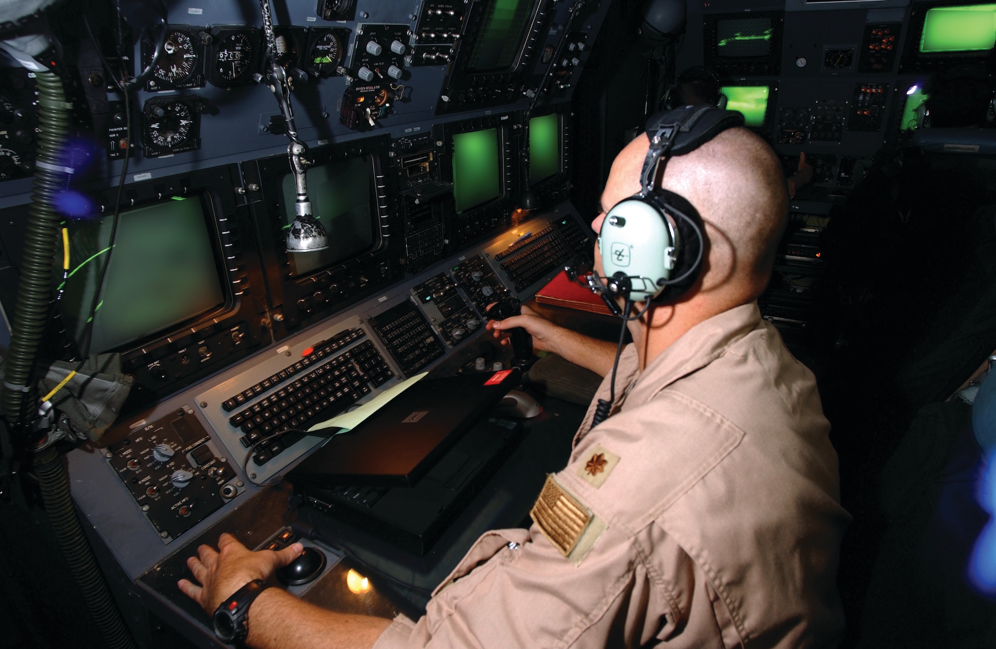 A navigator with the 4th Special Operations Squadron plots the course and provides guidance to the pilots of the AC-130U Spooky gunship during a mission in a deployed location. (Courtesy photograph)