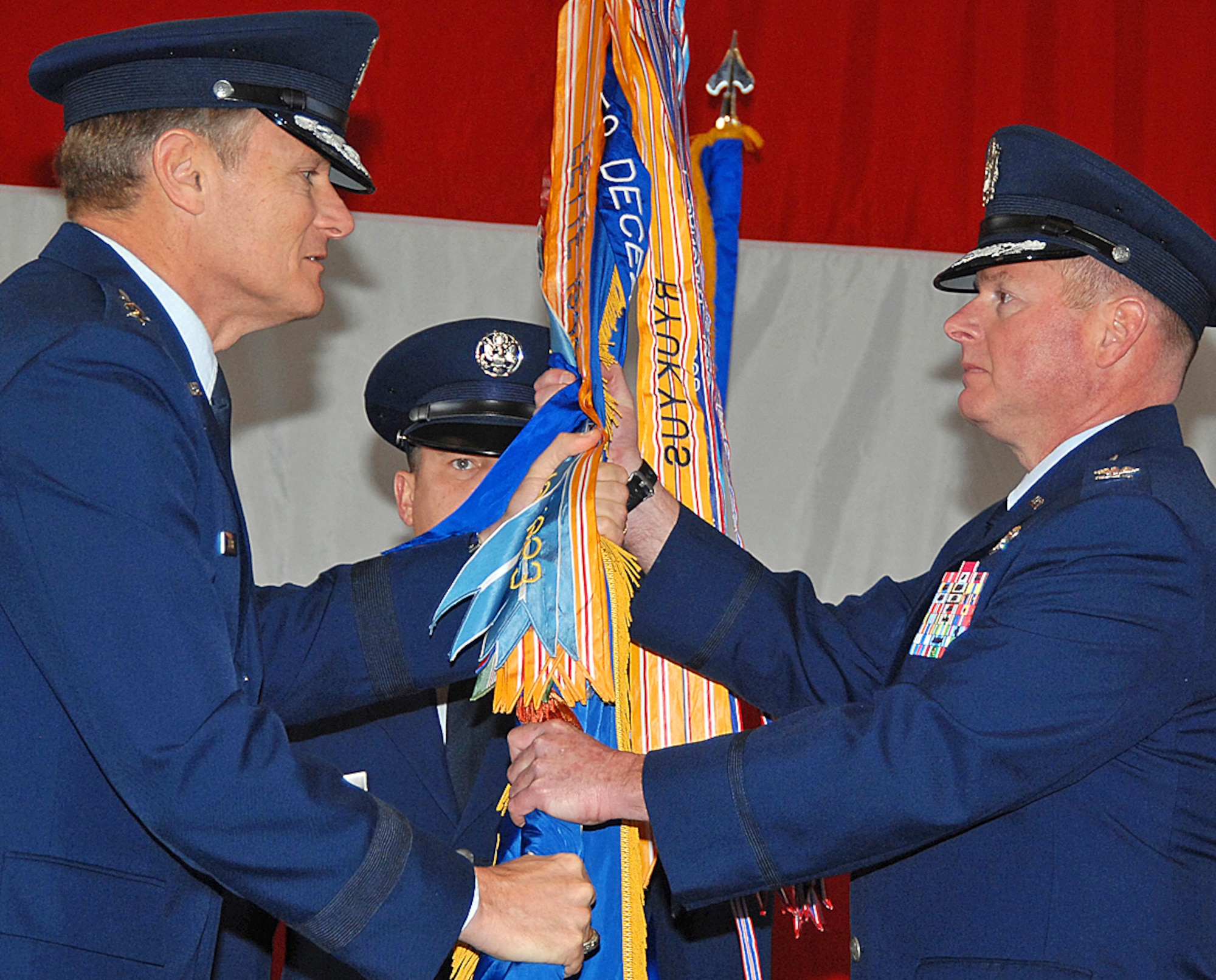 Maj. Gen. Irving L. Halter Jr., 19th Air Force commander, Randolph Air Force Base, Texas, hands the 58th Special Operations Wing?s guidon to the wing?s new commander, Col. Eugene Haase here. (U.S. Air Force photo by Todd Berenger)