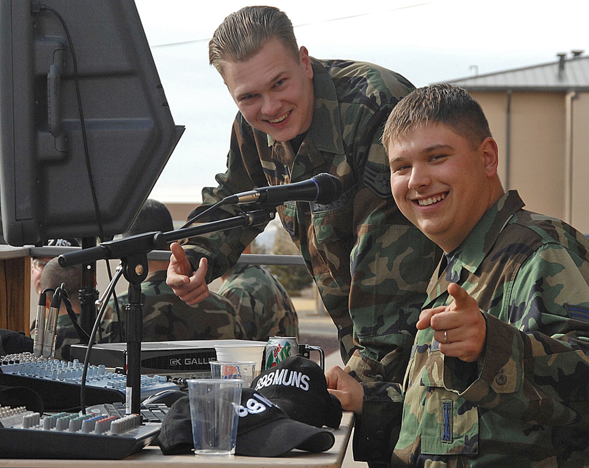 Staff Sgt. Geoffrey Cormier and Staff Sgt Cliff Oliver, 898th Munitions Squadron, here, provide music for the Airmen at the after the Nuclear Surety Inspection burger burn, Jan. 29. (U.S. Air Force photo by Todd Berenger)