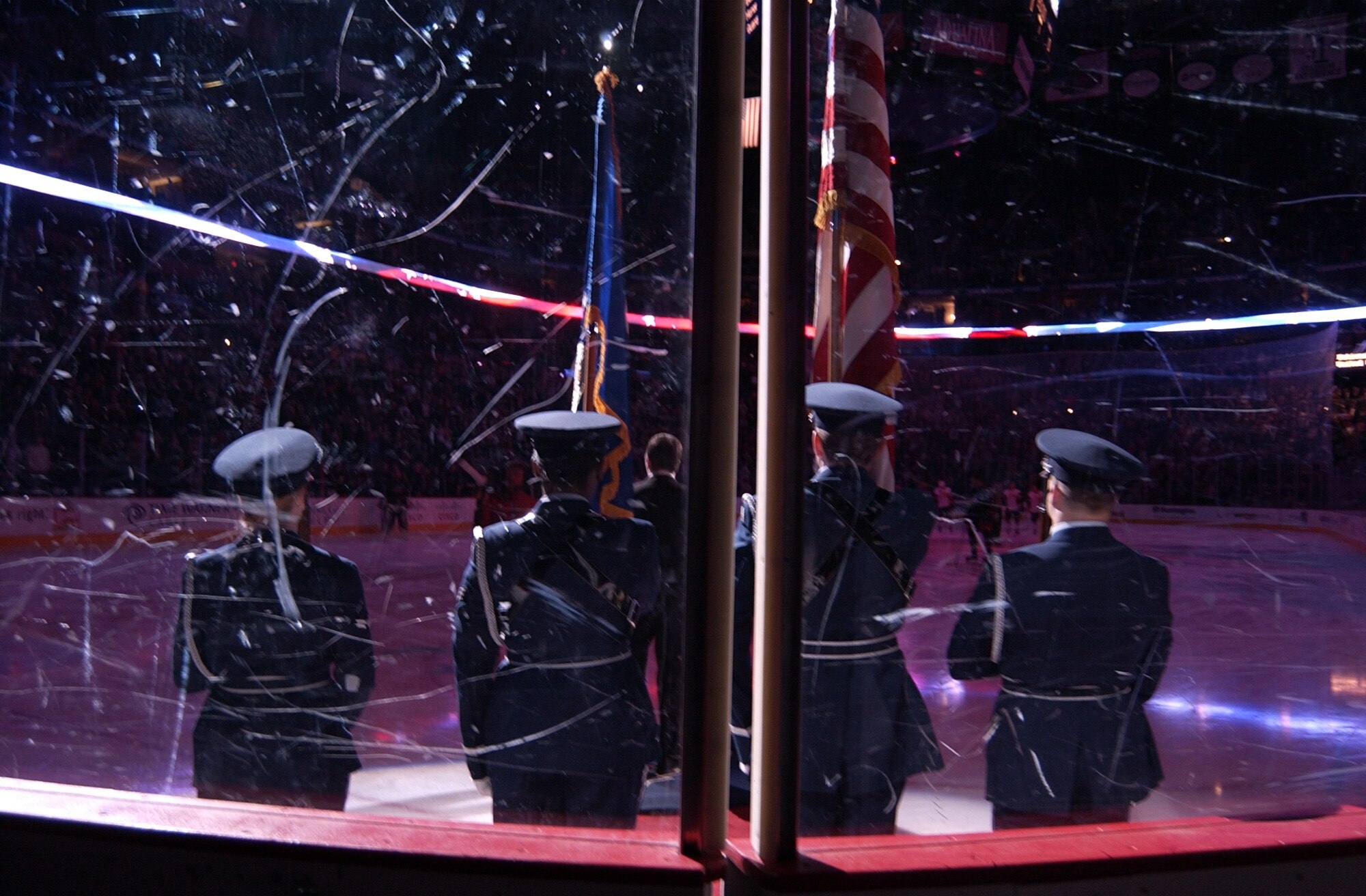 The Wright-Patterson AFB Honor Guard presents the colors during the national anthem Jan. 26 as the Columbus Blue Jackets prepare to play the Buffalo Sabres in a National Hockey League game celebrating the 60th anniversary of the Air Force. From left Airman 1st Class Christine Prince, Senior Airmen Kellen Brown, Kyle Velasquez and Airman 1st Class Josh Rican. (Air Force photo/Spencer P. Lane)