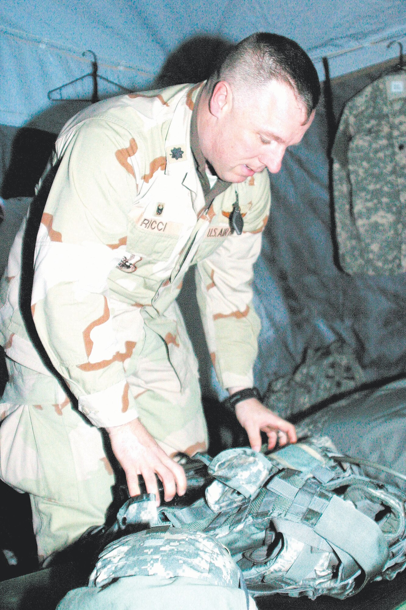 FORT BRAGG, N.C.--Lt. Col. Robert Ricci, a provincial reconstruction team commander currently training on Fort Bragg, organizes his training gear in his tent Jan. 25. The PRT teams are training to replace the team currently in Afghanistan. Colonel Ricci is stationed at Pope Air Force Base, N.C.