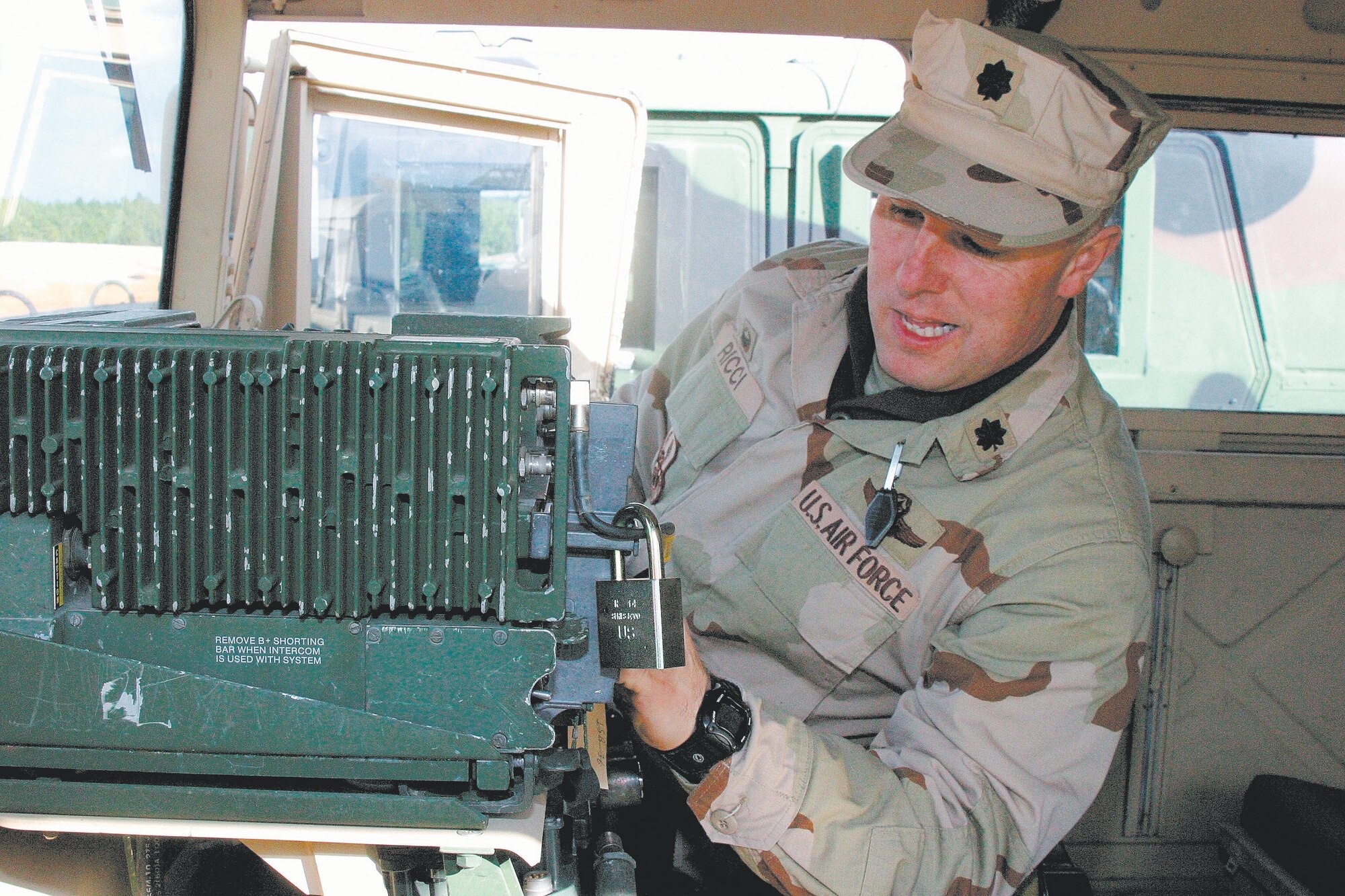 FORT BRAGG, N.C. -- Lt. Col. Robert Ricci does a routine check on a vehicle. Colonel Ricci and his provincial reconstruction team are currently training on Fort Bragg to replace the  PRT in Afghanistan. Colonel Ricci's team is scheduled to go to Mahtar Lam, 50 miles east of Kabul.  (U.S. Air Force photo/Staff Sgt. Cassandra Locke)