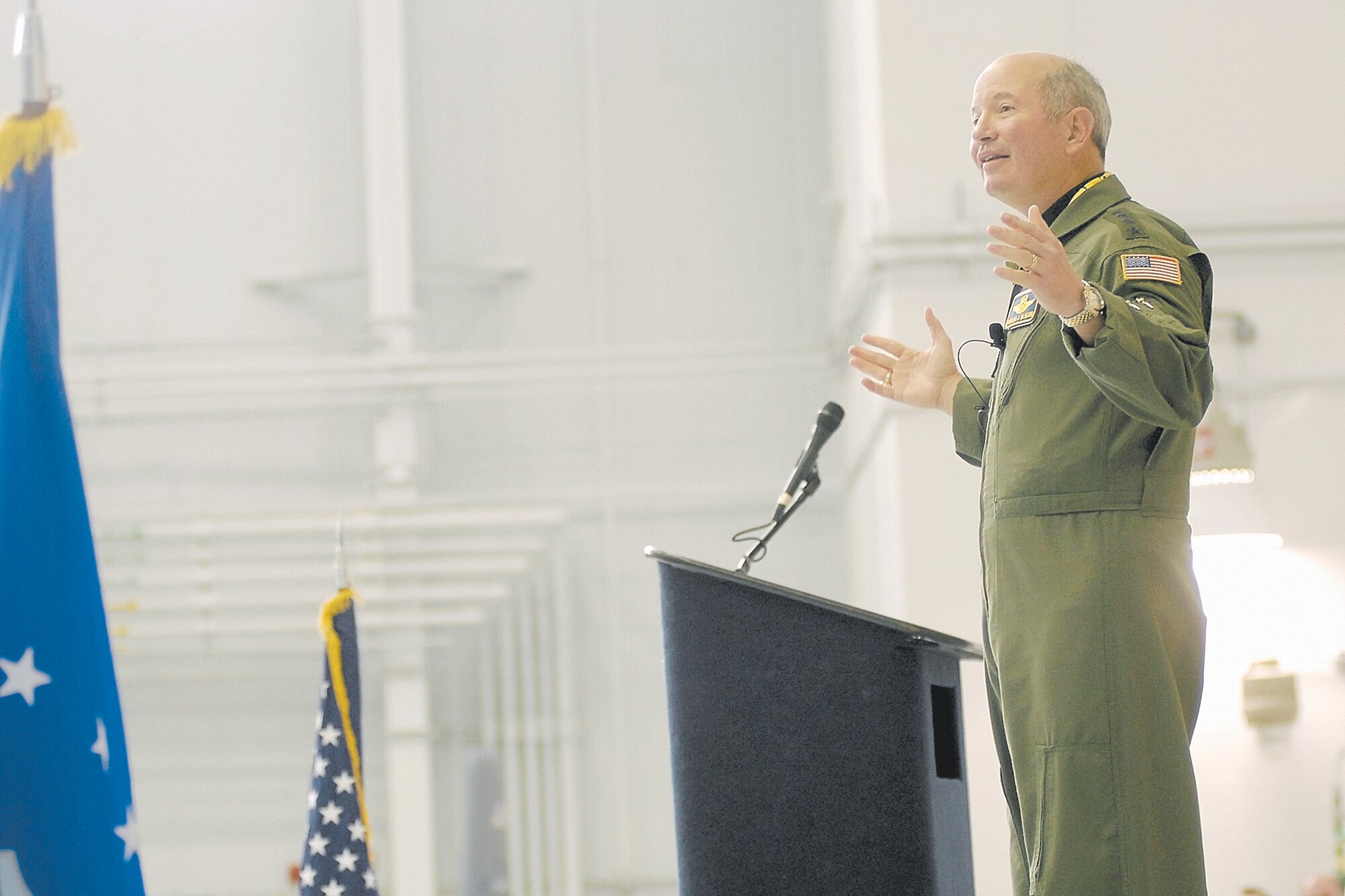 Gen. Duncan McNabb, Air Mobility Command Commander, addresses Team Pope during a commander's call while visiting Pope Jan. 25 and 26.