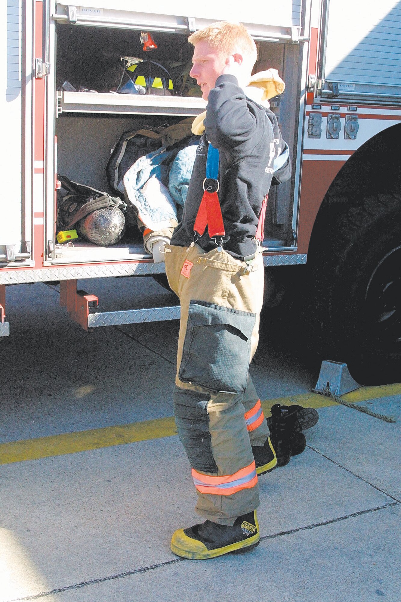 Senior Airman Dustin Hensley, a firefighter with the 43rd CES, demonstrated the process of suiting up to respond to an emergency. The firefighters move quickly and are dressed and on-scene within minutes.