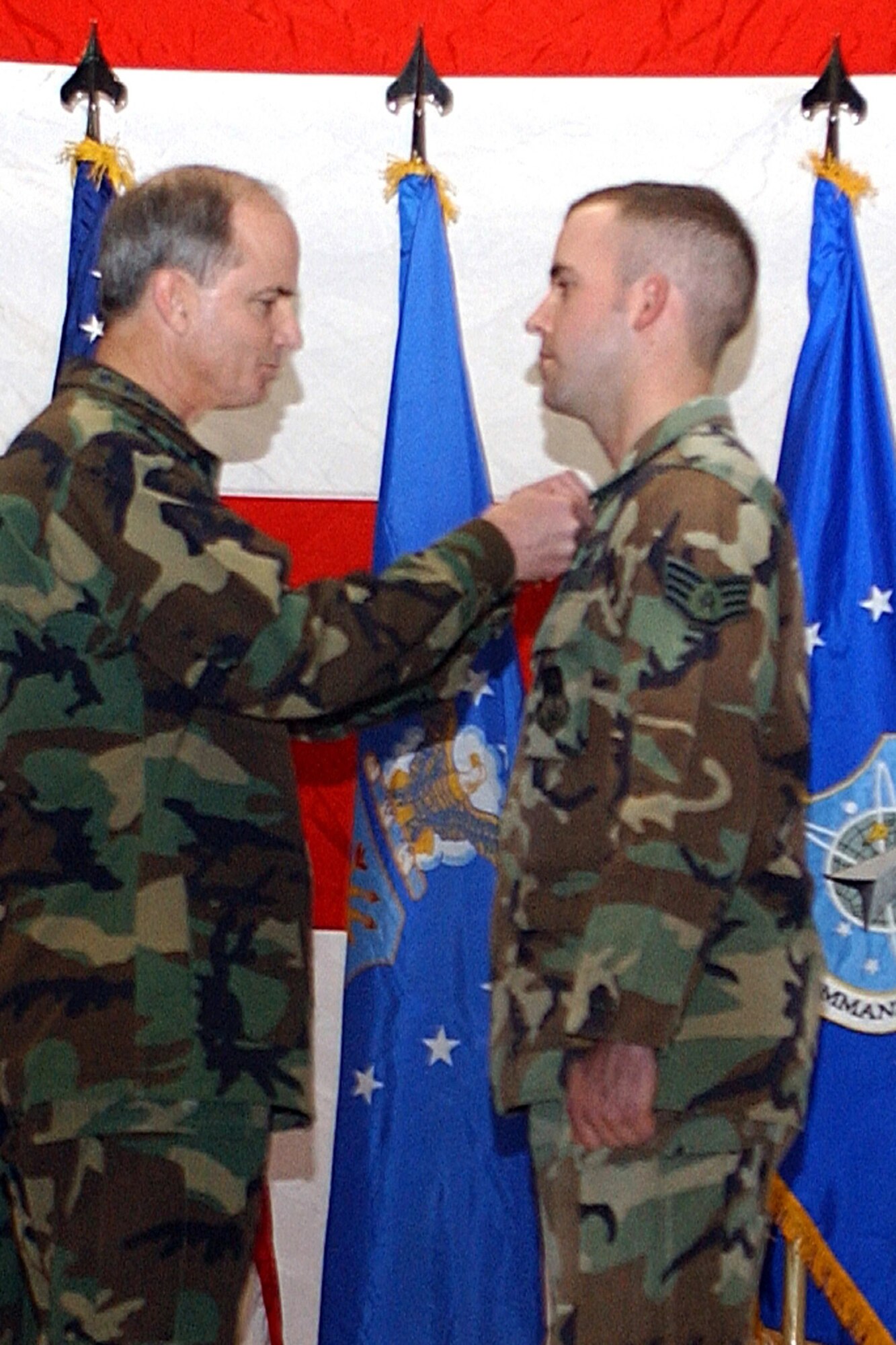 Gen. Kevin P. Chilton, Air Force Space Command commander, awards Staff Sgt. Joshua Abrahamson, 341st Civil Engineer Squadron, with the bronze star for his meritorious service ovrseas.