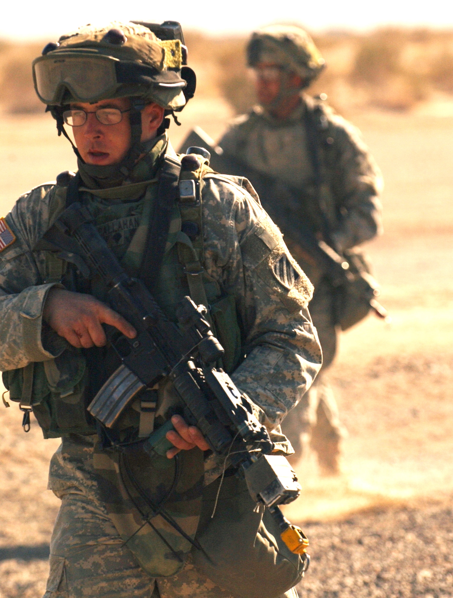 Soldiers takes part in a route clearance training scenario Jan. 22 at the National Training Center at Fort Irwin, Calif. Soldiers and Airmen are trained in a number of different scenarios that will help better prepare themselves for Iraq. The Soldiers are members of Echo Company, 2-69 Armor Battalion from Fort Benning, Ga. (U.S. Air Force photo/Staff Sgt. Dennis J. Henry Jr.) 
