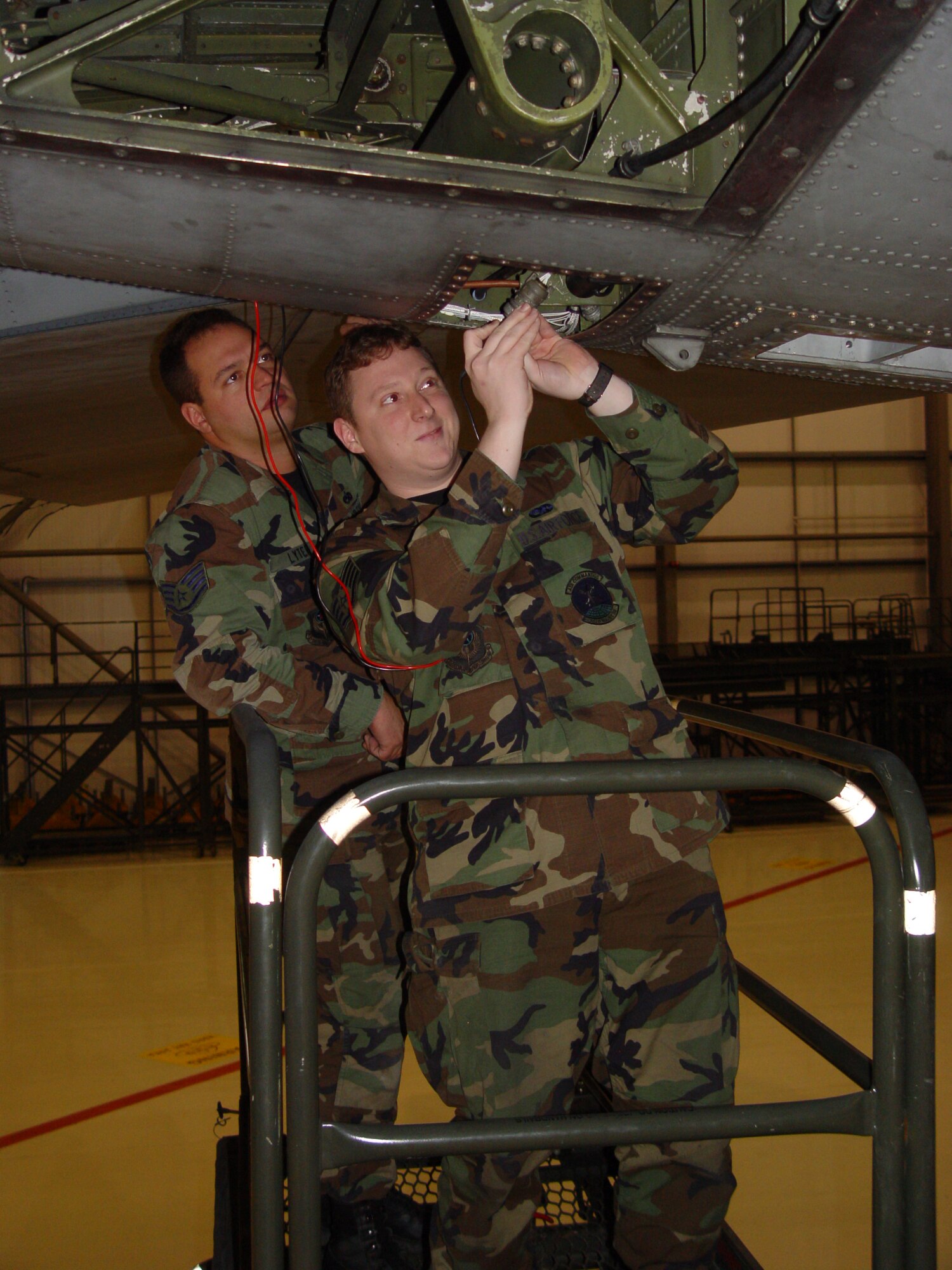 Staff Sgt. Brian Lyter, left, and Staff Sgt. Robert Burton, 352nd MXS isochronal guidance-control inspection technicians, troubleshoot an elevator trim control system at RAF Mildenhall.