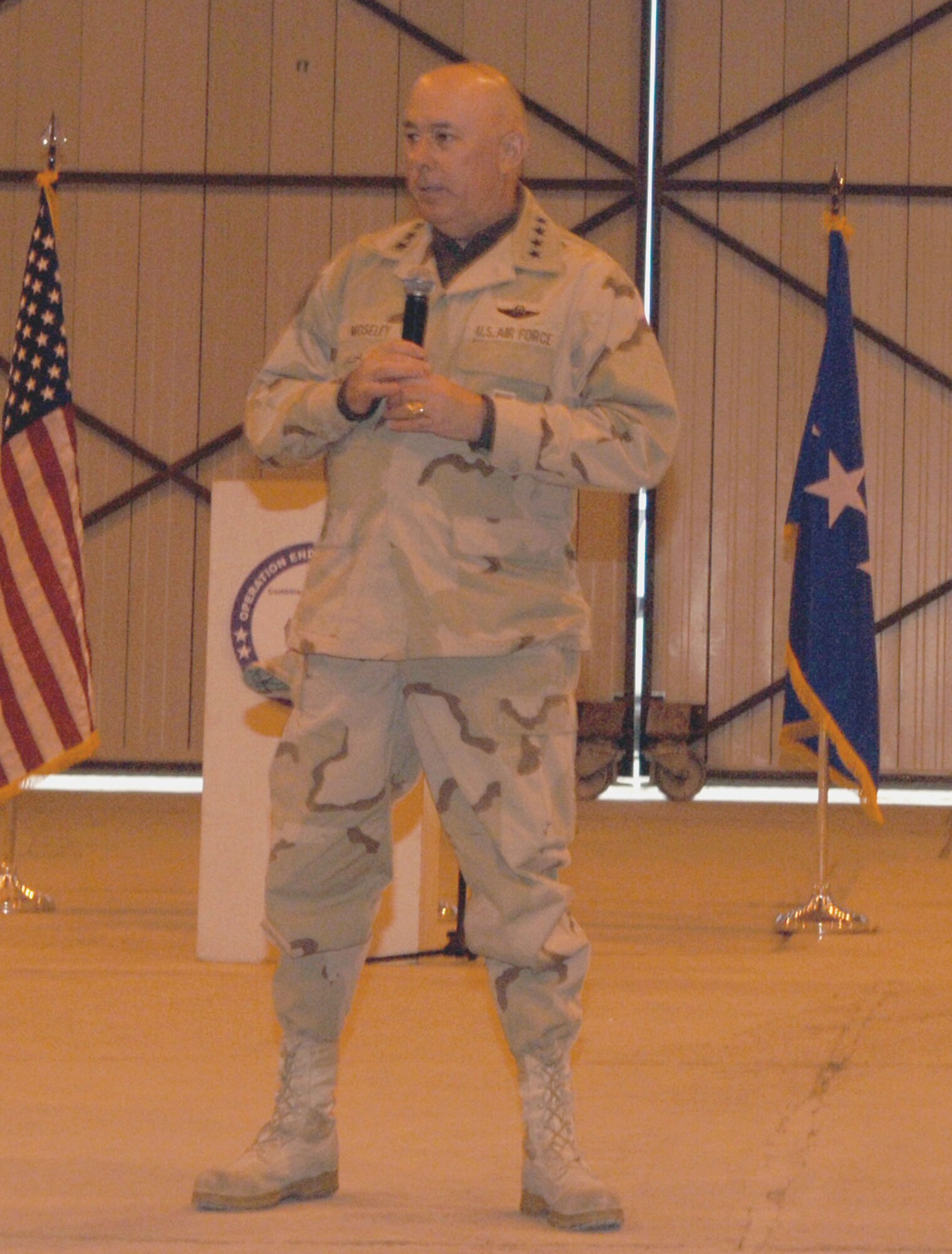 Air Force Chief of Staff Gen. T. Michael Moseley answers questions during an Airmen's call at Bagram Airfield, Afghanistan, Feb. 2. The general stopped at Bagram and Kandahar airfields during a tour of Afghanistan. (U.S. Air Force photo/Staff Sgt. Kevin Tomko)