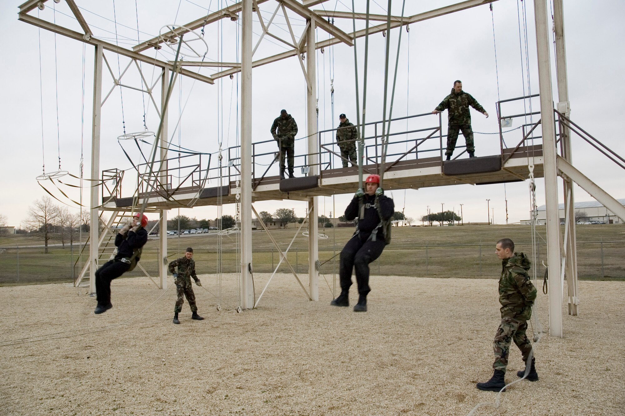 ELDP students experience what it feels like to swing in a parachute harness during Parachute Landing training conducted by USAFSAM aerospace physiology technicians at Brooks City-Base. (U.S. Air Force photo by Steve Thurow)