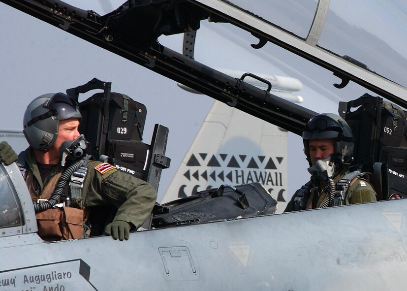 Maj. Brian Kilty, F-15 pilot with the Hawaii Air National Guard's 199th Fighter Squadron, Hickam Air Force Base, Hawaii, takes Wing Commander Napassdol Pavarabaddhanaguna, an F-16 pilot with the 103 Squadron, Royal Thai Air Force on an Orientation flight during the Cope Tiger 2007 Exercise in Korat, Thailand.  Cope Tiger is a multilateral combined air exercise involving the U.S., Thailand and Singapore.  The familiarization flight provides a quality venue to develop multilateral interoperability and demonstrates coalition procedures for air power missions. (USAF photo by Master Sgt. Kristen Higgins)