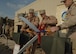 01/27/2007 -- BALAD AIR BASE, Iraq -- Misawa Airmen cut the ribbon during a ceremony officially standing up the third fighter squadron at the base. The 14th Fighter Squadron deployed earlier this month in support of Operation Iraqi Freedom. (U.S. Air Force photo)