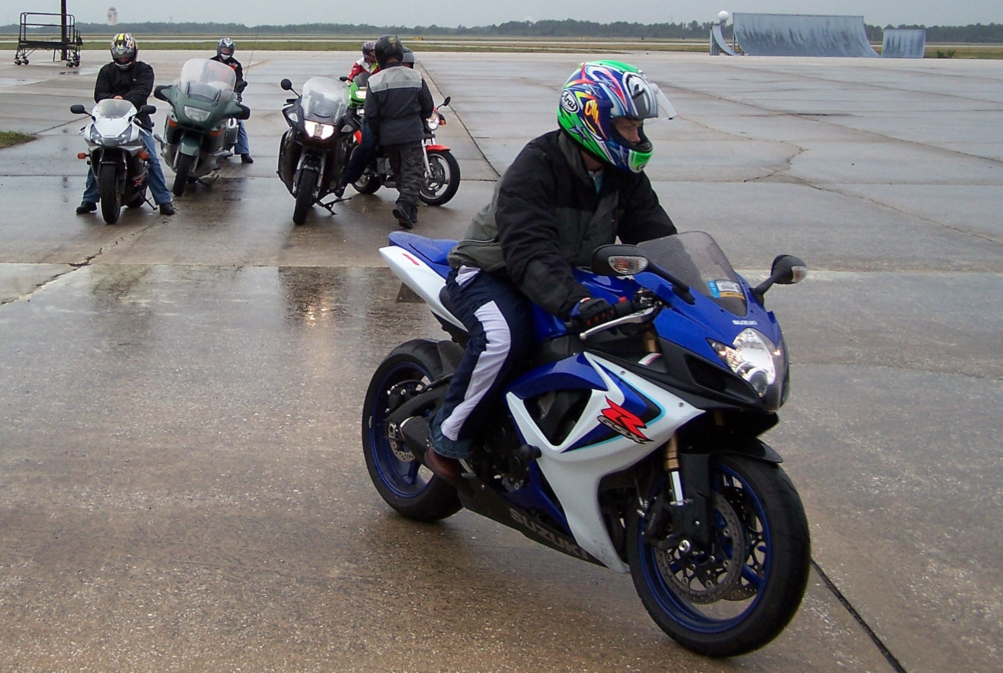 Airmen ride their motocycles while a video crew shoot footage for a new motorcycle safety DVD Jan. 24 at MacDill Air Force Base, Fla. The video will be a part of a safety DVD used by the military and is set to release in the spring. (U.S. Air Force photo)