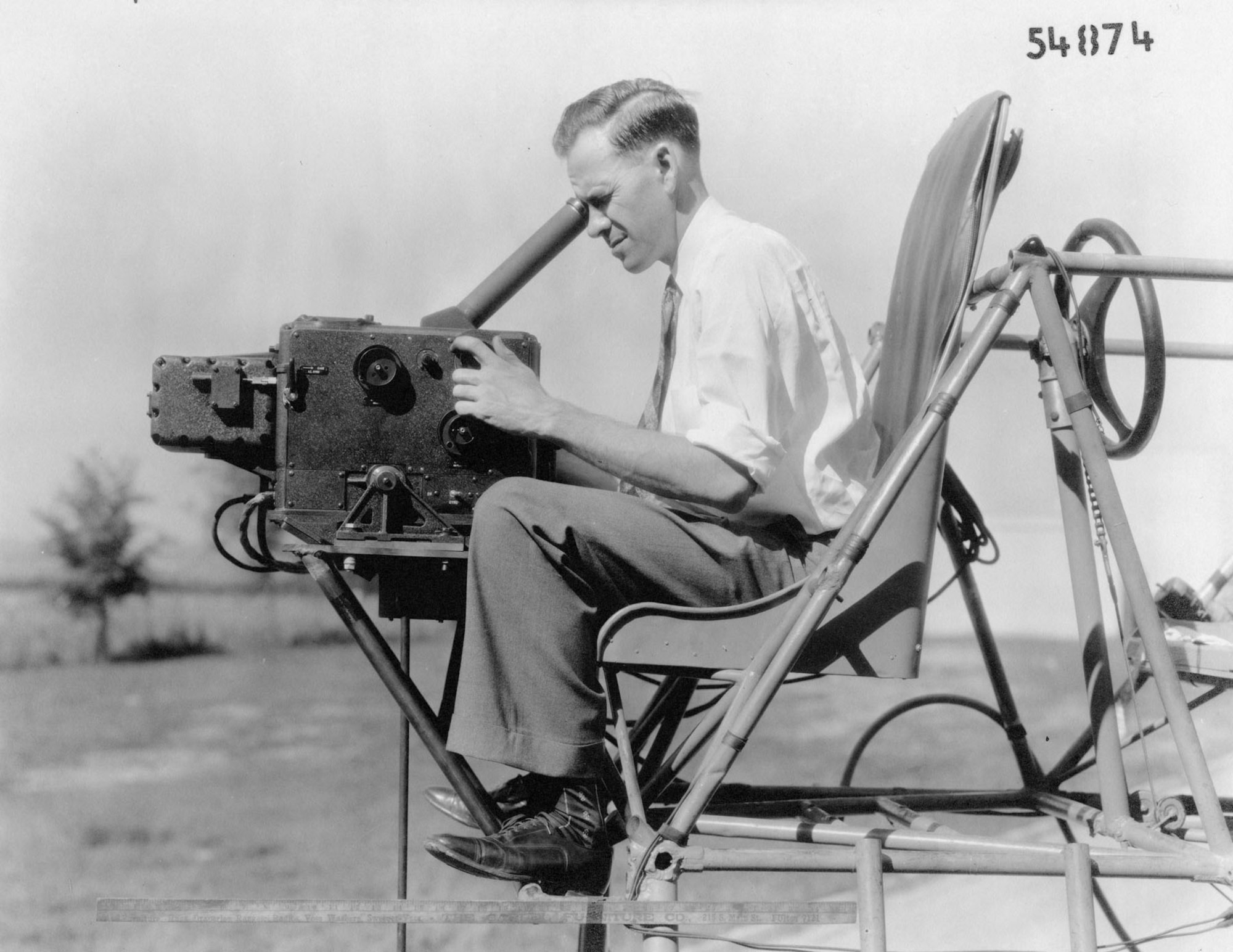 A variant of the Sperry bombsight undergoing evaluation by the Engineering Division in 1936. This photograph shows how a bombardier would operate it. (U.S. Air Force photo)