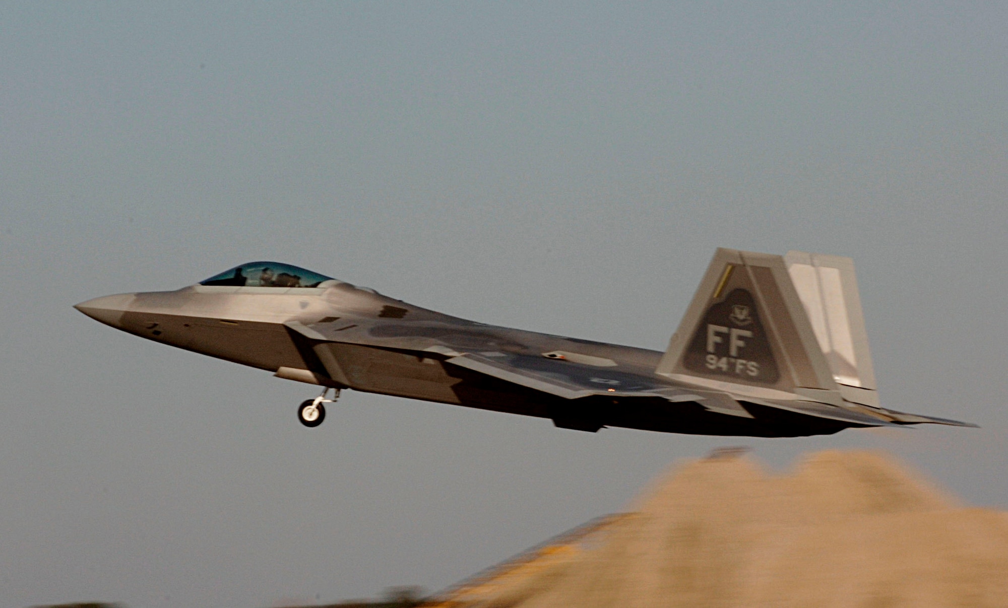 Lt. Col. Dirk Smith takes flight in an F-22 Raptor Feb. 3 at Langley Air Force Base in Virginia.The 94th Fighter Squadron is deploying for Red Flag at Nellis AFB, Nev. Red Flag is an air combat training exercise designed to test pilots and air support crews' ability to affectively respond to real-world combat scenarios. This is the first deployment to Red Flag for the 94th FS with F-22s. Colonel Smith is the 94th FS commander. (U.S. Air Force photo/Staff Sgt. Samuel Rogers) 
