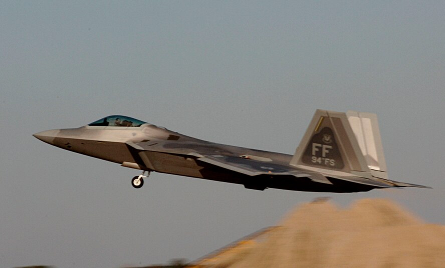 NELLIS AIR FORCE BASE, Nev. (ACCNS) -- Lt. Col. Dirk Smith takes flight in an F-22 Raptor Feb. 3 at Langley Air Force Base in Virginia.The 94th Fighter Squadron is deploying for Red Flag at Nellis AFB, Nev. Red Flag is an air combat training exercise designed to test pilots and air support crews' ability to affectively respond to real-world combat scenarios. This is the first deployment to Red Flag for the 94th FS with F-22s. Colonel Smith is the 94th FS commander. (U.S. Air Force photo/Staff Sgt. Samuel Rogers) 