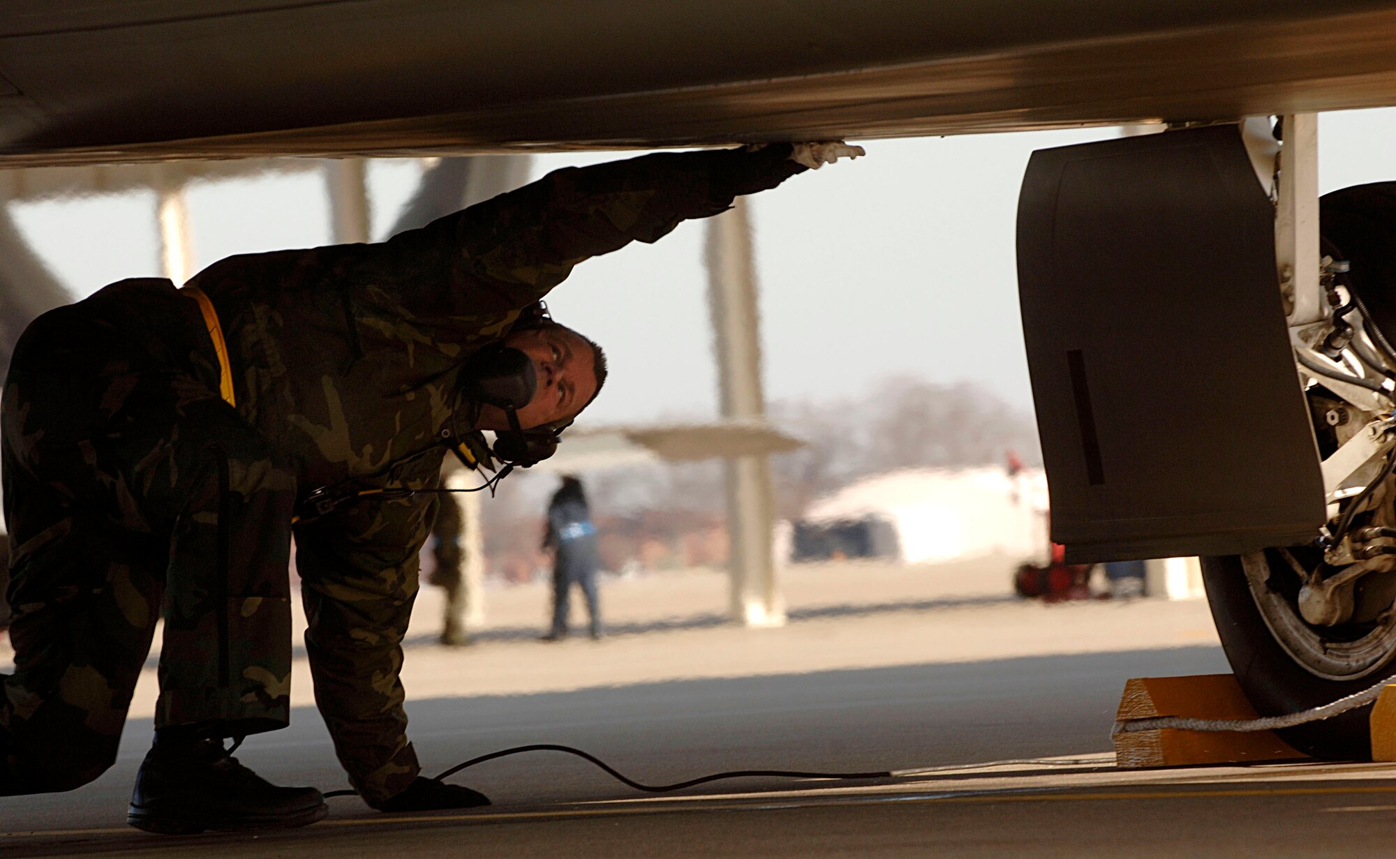 Staff Sgt Tom Mills goes through a series of aircraft checks Feb. 3 at Langley Air Force Base in Virginia.The 94th Fighter Squadron is deploying for Red Flag at Nellis AFB, Nev. Red Flag is an air combat training exercise designed to test pilots and air support crews' ability to affectively respond to real-world combat scenarios. This is the first deployment to Red Flag for the 94th FS with F-22s. Sergeant Mills is a crew chief with 192nd Virginia Air National Guard assigned to the 94th Aircraft Maintanence Unit. (U.S. Air Force photo/Staff Sgt. Samuel Rogers) 