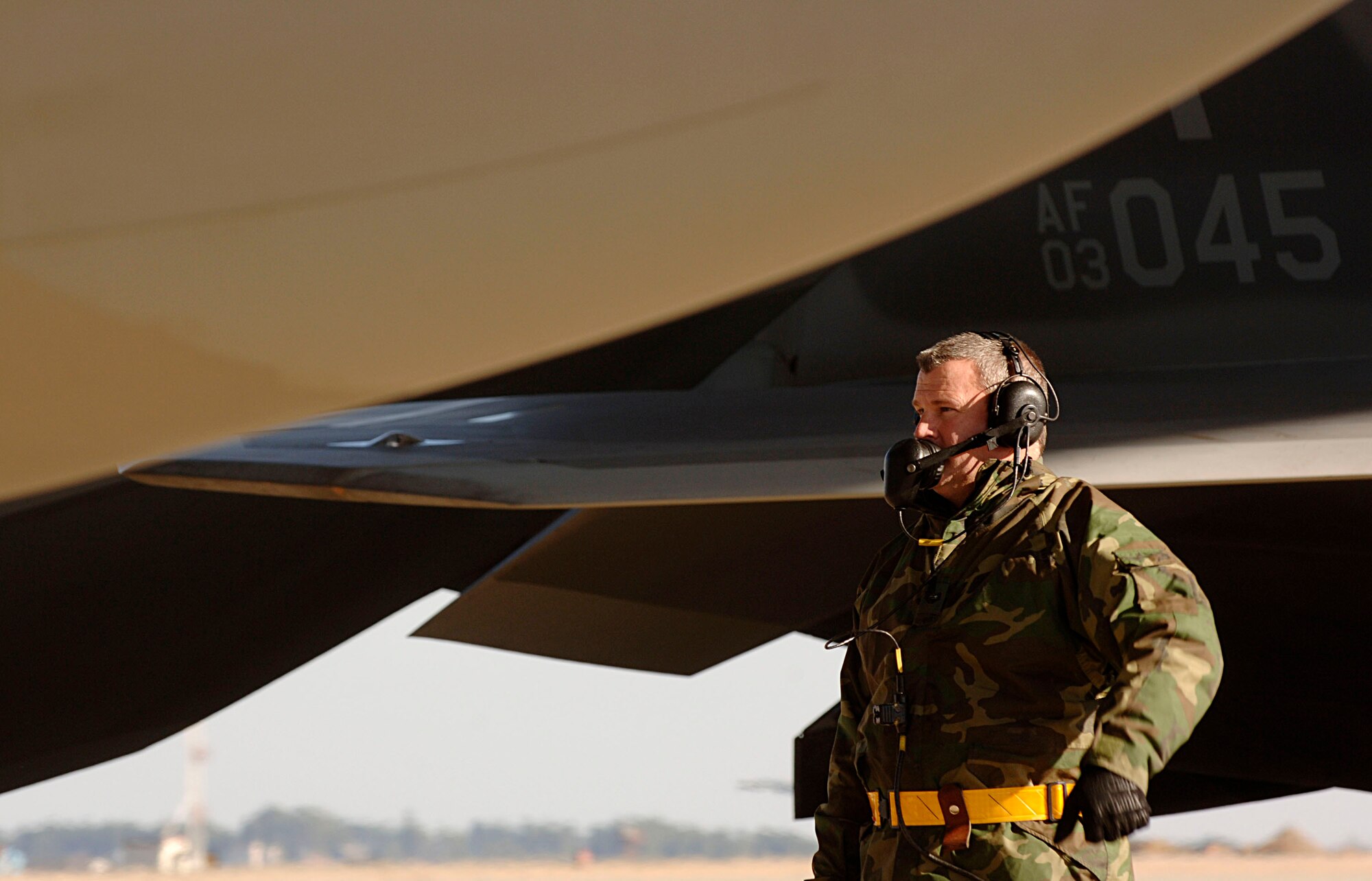 Staff Sgt Tom Mills goes through a series of aircraft checks with Maj. Patrick Deconcini Feb. 3 at Langley Air Force Base in Virginia.The 94th Fighter Squadron is deploying for Red Flag at Nellis AFB, Nev. Red Flag is an air combat training exercise designed to test pilots and air support crews' ability to affectively respond to real-world combat scenarios. This is the first deployment to Red Flag for the 94th FS with F-22s. Sergeant Mills is a crew chief with 192nd Virginia Air National Guard assigned to the 94th Aircraft Maintanence Unit. Major Deconcini is a 192nd Virginia Air National Guard pilot with the 94th Fighter Squadron. (U.S. Air Force photo/Staff Sgt. Samuel Rogers) 