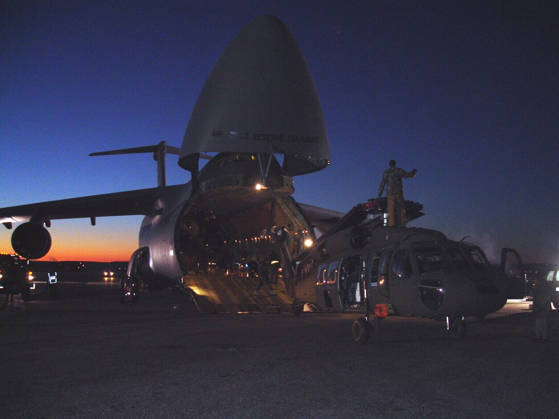 Soldiers and Airmen load three South Dakota Army National Guard UH-60 Black Hawk helicopters aboard a C-5A Galaxy aircraft Tuesday, Jan. 30, at Ellsworth Air Force Base in preparation for support to a humanitarian assistance exercise in Nicaragua.

This joint operation between the U.S. Air Force and the South Dakota National Guard is in support of a humanitarian assistance exercises in Nicaragua known as New Horizons, which involves construction of schools, clinics, and water wells in countries throughout the U.S. Southern Command region. These humanitarian assistance exercises, which last several months each, provide much needed services and infrastructure, while providing critical training for deployed U.S. military forces. These exercises generally take place in rural, underprivileged areas.

The helicopters loaded belong to Company C, 1st Battalion, 189th Aviation, which is a South Dakota Army National Guard air-ambulance unit based in Rapid City. Approximately 125 Soldiers from the National Guard unit will be providing general aviation and casualty evacuation from Feb. 4 to May 6 in support of the exercise in Nicaragua. (South Dakota Army National Guard photo/Maj. Orson Ward.) 