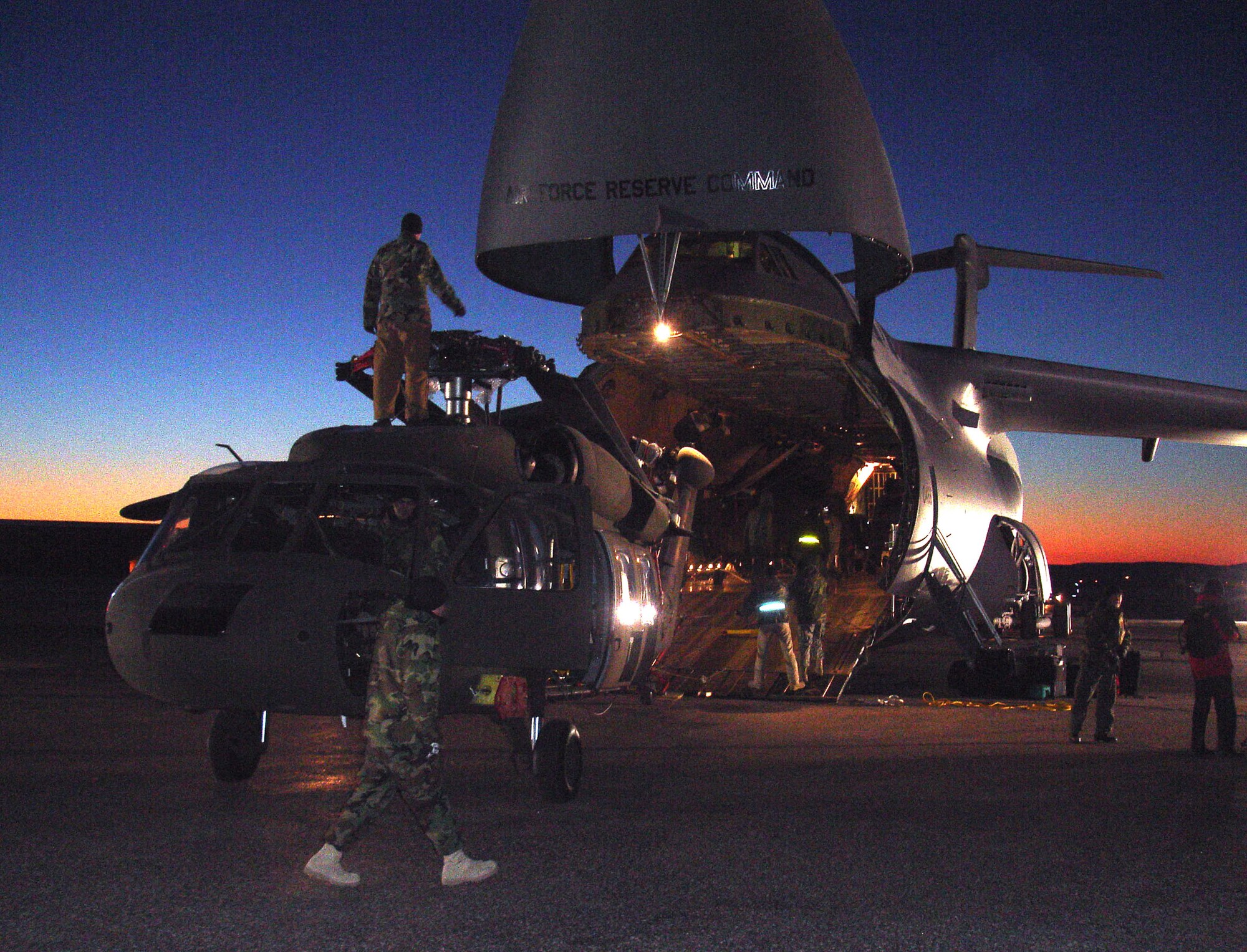 Soldiers and Airmen load three South Dakota Army National Guard UH-60 Black Hawk helicopters aboard a C-5A Galaxy aircraft Tuesday, Jan. 30, at Ellsworth Air Force Base in preparation for support to a humanitarian assistance exercise in Nicaragua.

This joint operation between the U.S. Air Force and the South Dakota National Guard is in support of a humanitarian assistance exercises in Nicaragua known as New Horizons, which involves construction of schools, clinics, and water wells in countries throughout the U.S. Southern Command region. These humanitarian assistance exercises, which last several months each, provide much needed services and infrastructure, while providing critical training for deployed U.S. military forces. These exercises generally take place in rural, underprivileged areas.

The helicopters loaded belong to Company C, 1st Battalion, 189th Aviation, which is a South Dakota Army National Guard air-ambulance unit based in Rapid City. Approximately 125 Soldiers from the National Guard unit will be providing general aviation and casualty evacuation from Feb. 4 to May 6 in support of the exercise in Nicaragua. (South Dakota Army National Guard photo/Maj. Orson Ward.) 