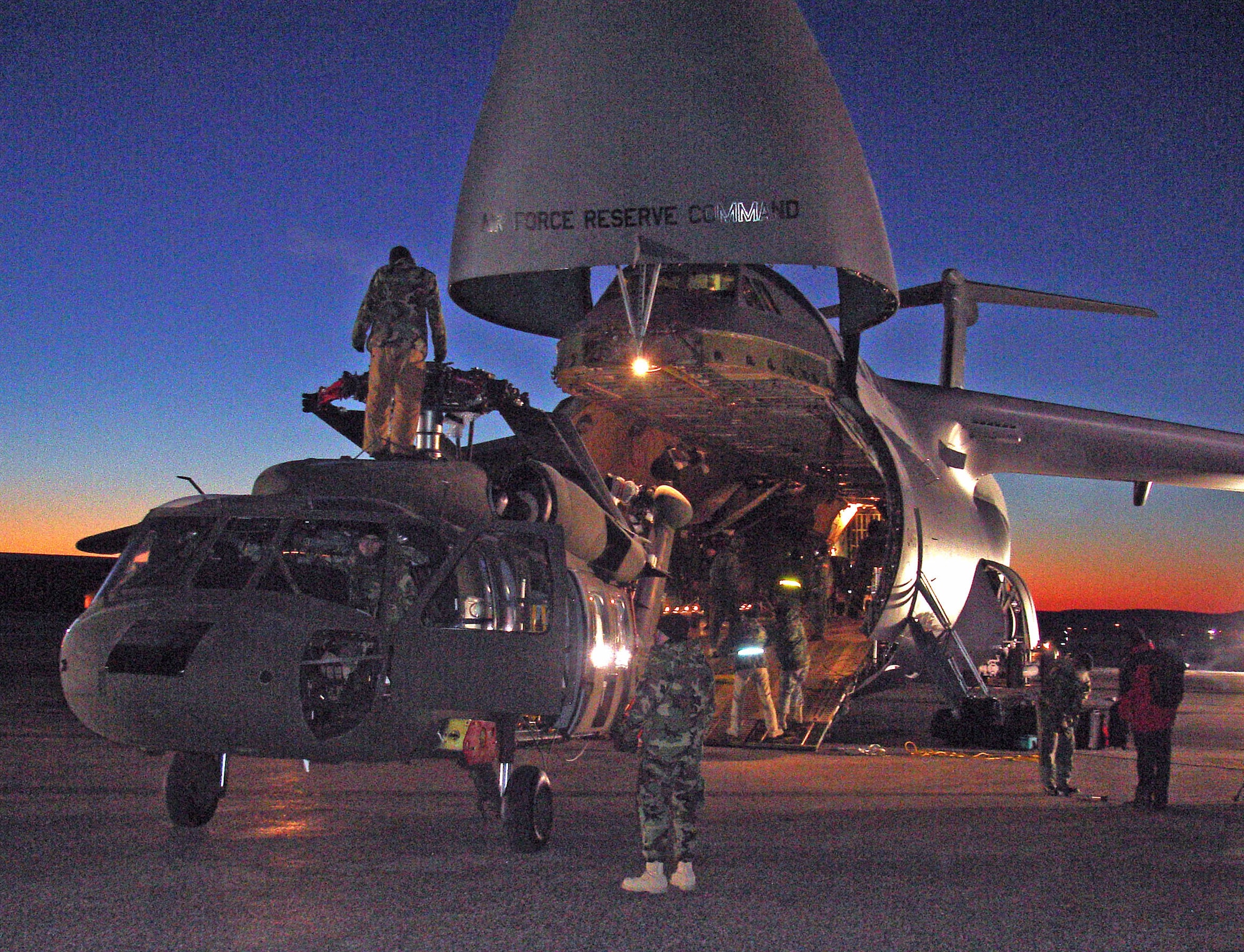 Soldiers and Airmen load three South Dakota Army National Guard UH-60 Black Hawk helicopters aboard a C-5A Galaxy aircraft Tuesday, Jan. 30, at Ellsworth Air Force Base in preparation for support to a humanitarian assistance exercise in Nicaragua.

This joint operation between the U.S. Air Force and the South Dakota National Guard is in support of a humanitarian assistance exercises in Nicaragua known as New Horizons, which involves construction of schools, clinics, and water wells in countries throughout the U.S. Southern Command region. These humanitarian assistance exercises, which last several months each, provide much needed services and infrastructure, while providing critical training for deployed U.S. military forces. These exercises generally take place in rural, underprivileged areas.

The helicopters loaded belong to Company C, 1st Battalion, 189th Aviation, which is a South Dakota Army National Guard air-ambulance unit based in Rapid City. Approximately 125 Soldiers from the National Guard unit will be providing general aviation and casualty evacuation from Feb. 4 to May 6 in support of the exercise in Nicaragua. (South Dakota Army National Guard photo/Maj. Orson Ward.) 