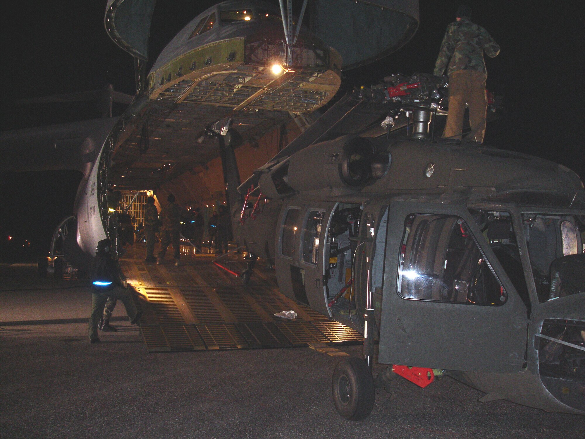 Soldiers and Airmen load three South Dakota Army National Guard UH-60 Black Hawk helicopters aboard a C-5A Galaxy aircraft Tuesday, Jan. 30, at Ellsworth Air Force Base in preparation for support to a humanitarian assistance exercise in Nicaragua.

This joint operation between the U.S. Air Force and the South Dakota National Guard is in support of a humanitarian assistance exercises in Nicaragua known as New Horizons, which involves construction of schools, clinics, and water wells in countries throughout the U.S. Southern Command region. These humanitarian assistance exercises, which last several months each, provide much needed services and infrastructure, while providing critical training for deployed U.S. military forces. These exercises generally take place in rural, underprivileged areas.

The helicopters loaded belong to Company C, 1st Battalion, 189th Aviation, which is a South Dakota Army National Guard air-ambulance unit based in Rapid City. Approximately 125 Soldiers from the National Guard unit will be providing general aviation and casualty evacuation from Feb. 4 to May 6 in support of the exercise in Nicaragua. (South Dakota Army National Guard photo/Maj. Orson Ward.)