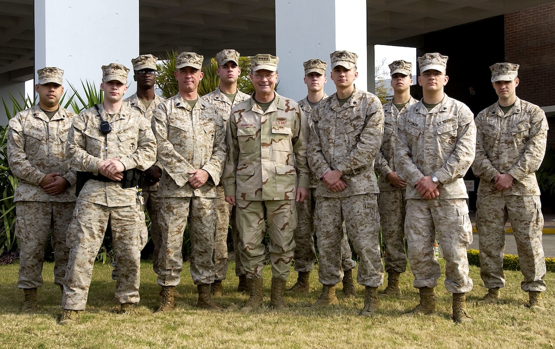 Vice Chairman of the Joint Chiefs of Staff Navy Adm. Edmund P. Giambastiani stands with the Marine Security Detail at the U.S. Embassy in Islamabad, Pakistan, Feb. 3, 2007. The admiral presented each Marine a coin and thanked them for their service. 