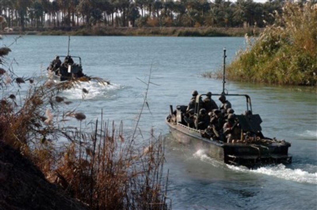 Paratroopers from Scout Platoon, 1st Battalion, 501st Parachute Infantry Regiment, 4th Brigade Combat Team, 25th Infantry Division, head out on a training mission on the Euphrates River, Feb. 5, 2007. Such training missions as this one helped the paratroopers get accustomed to water-borne operations.