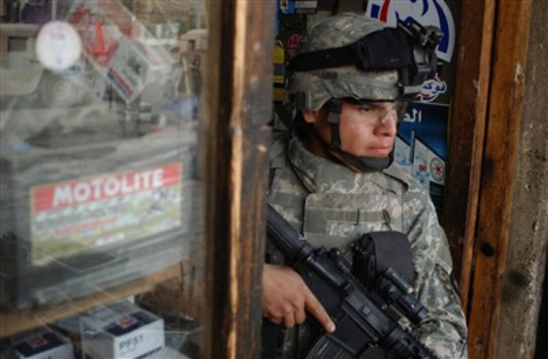 U S Army Sgt Victor Salazar Keeps An Eye On The Street Outside