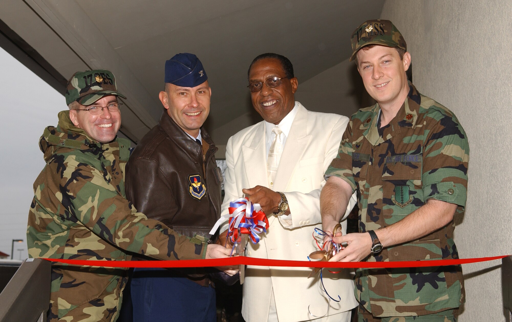 From right to left:  Maj. Pat Baker, 17th Civil Engineer Squadron commander, Col. Stephen Czerwinski, 17th Mission Support Group commander, Anthony Hooks, Airman and Family Readiness flight chief and Maj. Michael Gayer, 17th Mission Support Squadron commander, take part in a ribbon cutting ceremony for the Airman and Family Readiness Center Jan. 19.  (U.S. Air Force photo by Airman 1st Class Kamaile Chan)