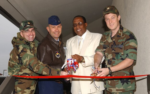 From right to left:  Maj. Pat Baker, 17th Civil Engineer Squadron commander, Col. Stephen Czerwinski, 17th Mission Support Group commander, Anthony Hooks, Airman and Family Readiness flight chief and Maj. Michael Gayer, 17th Mission Support Squadron commander, take part in a ribbon cutting ceremony for the Airman and Family Readiness Center Jan. 19.  (U.S. Air Force photo by Airman 1st Class Kamaile Chan)