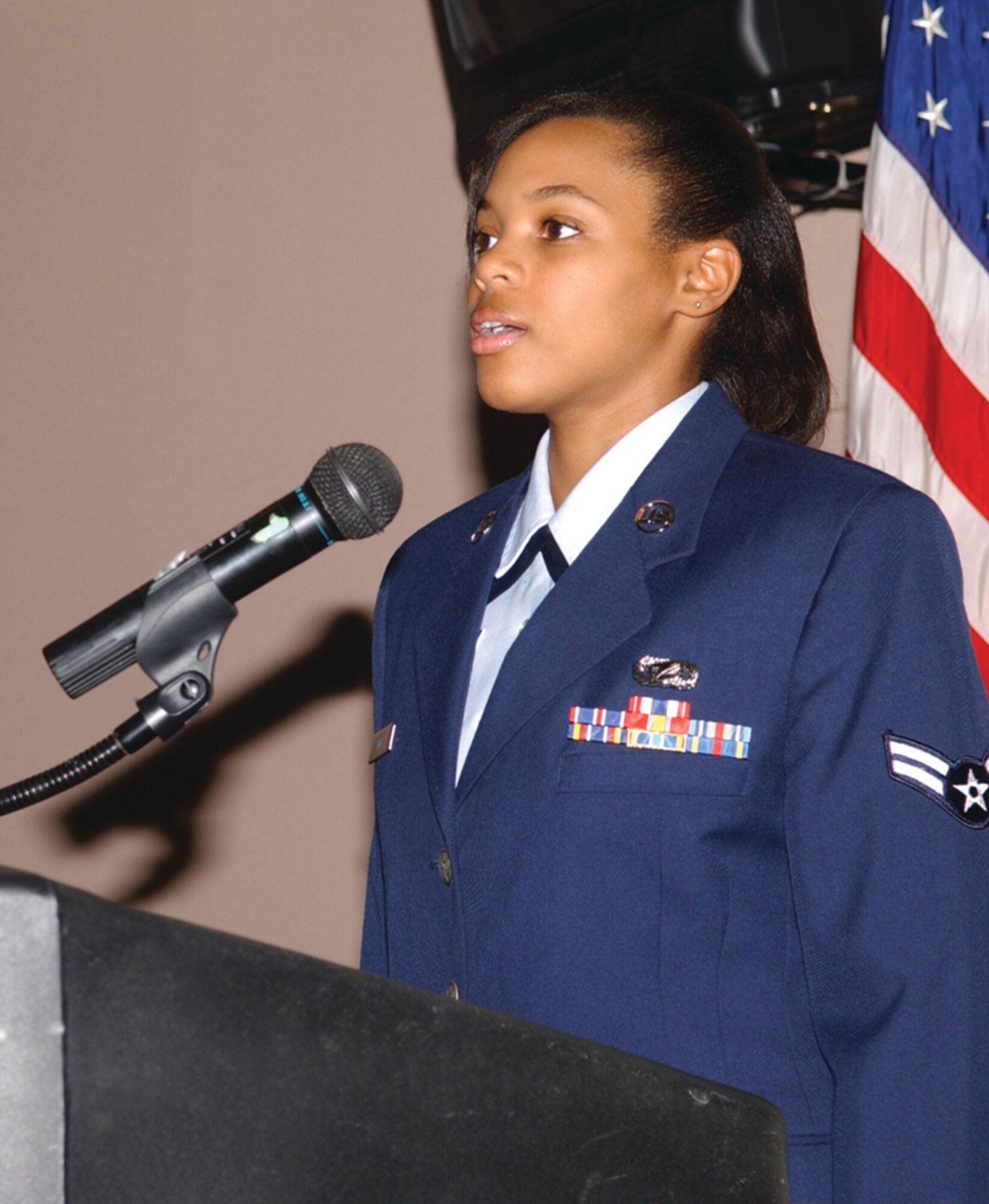 Airman 1st Class Teigess Jones sings the "Star Spangled Banner.".   (U.S. Air Force photo by Airman 1st Class Kamaile Chan)