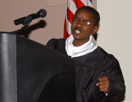 Ten-year-old Kertron Mackey was given a standing ovation for his special presentation on Dr. Martin Luther King Jr.  The elementary school student impressed audience members for the second year in a row with his interpretation of one of Dr. King's sermons during the Civil Rights Movement of the 1960s.  (U.S. Air Force photo by Airman 1st Class Kamaile Chan)