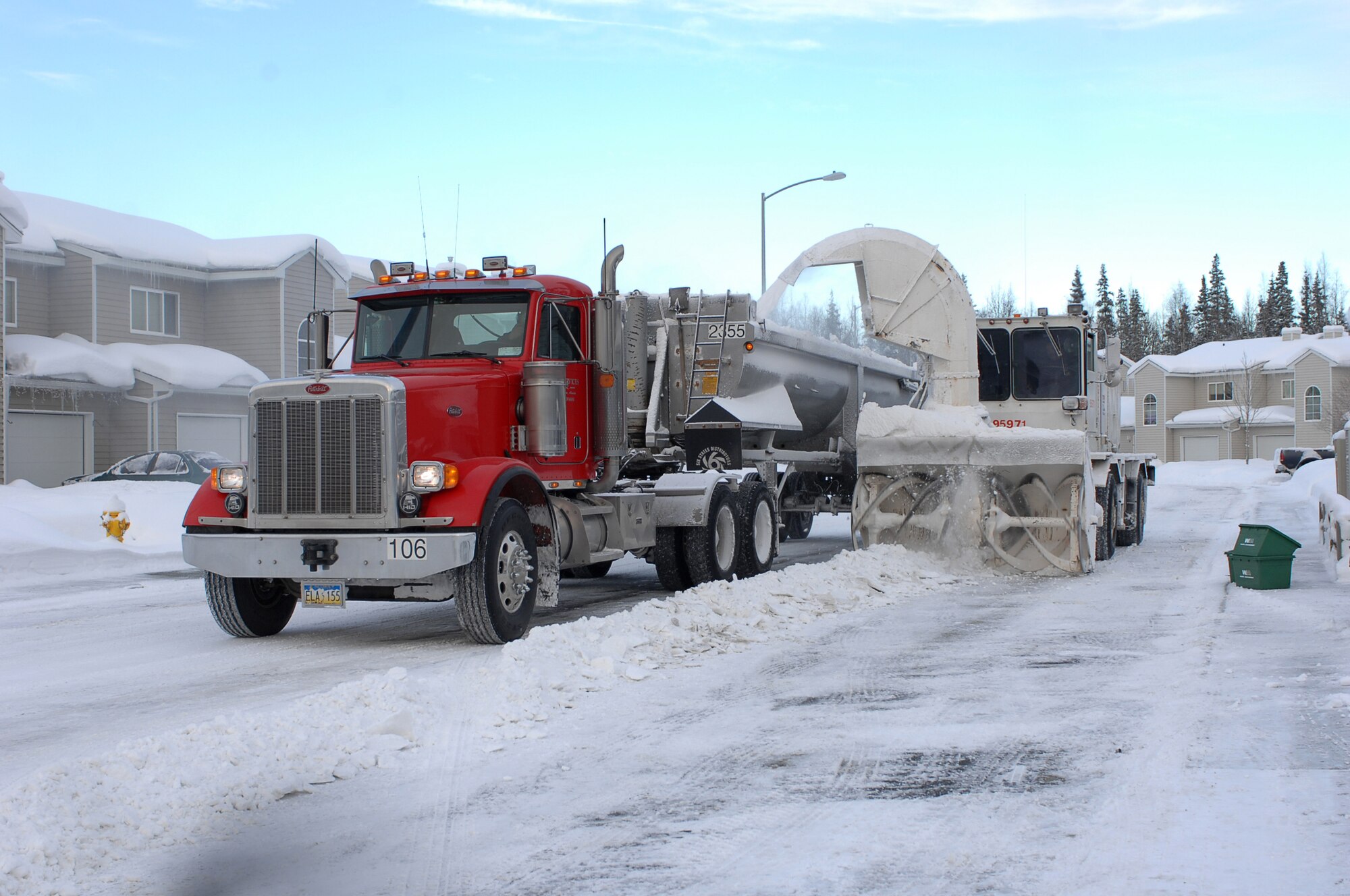 Members of the 3rd Civil Engineer Squadron Snow Removal Flight remove snow from base housing Monday. The flight won the Balchen/Post Award for the best snow removal team in the Air Force for the third time in consecutive attempts.