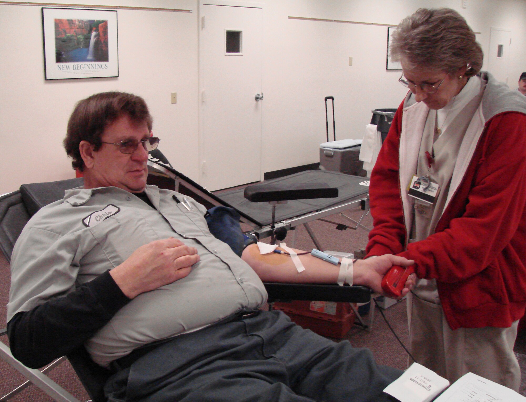 Chris Wanzer, Computer Sciences Corporation senior aircraft mechanic, relaxes while Renee Brown of Oklahoma Blood Institute draws some of his blood during the drive Feb. 2. Team Vance members have an opportunity to support OBI at one of the on-base blood drives which are scheduled every other month. (Photo by 2nd Lt. James Justice)