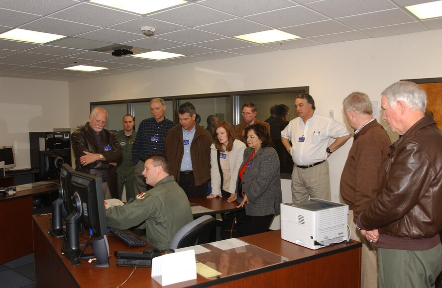 Airmen in the 381st Training Group explain aspects of space training with community leaders, while Gen. William R. Looney III (far right), commander of Air Education and Training Command, listens in. (Courtesy photo)