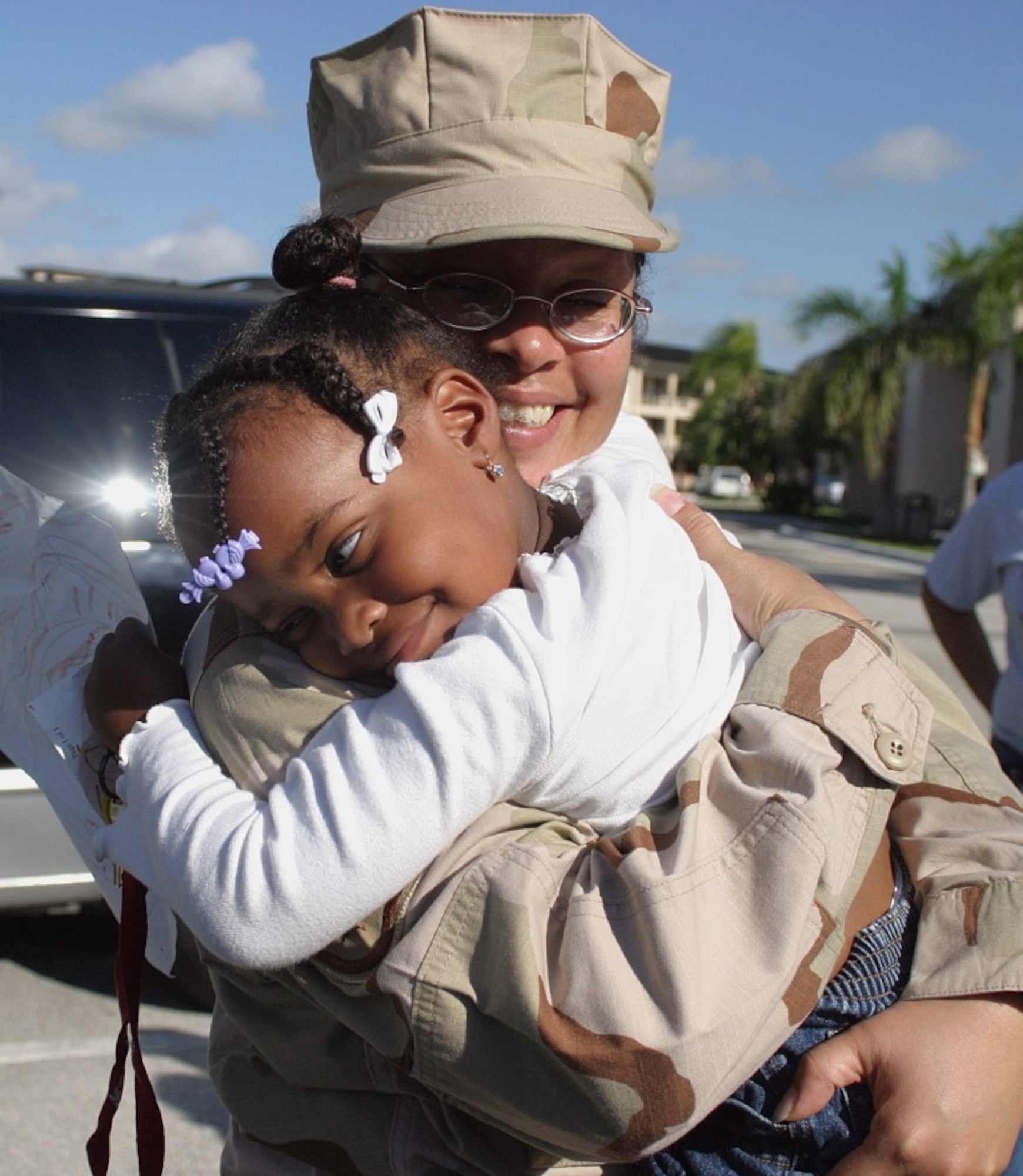 Staff Sgt. Mayra Williams, 482nd Services Squadron, reunites with her granddaughter here at Homestead Air Reserve Base, Fla. upon returning from Southwest Asia. Five members of the Services Squadron returned to South Florida Jan. 21 after deploying on Sep. 11 to support operations in the U.S. Central Command. (U.S. Air Force photo/Master Sgt. Ray Sarracino)