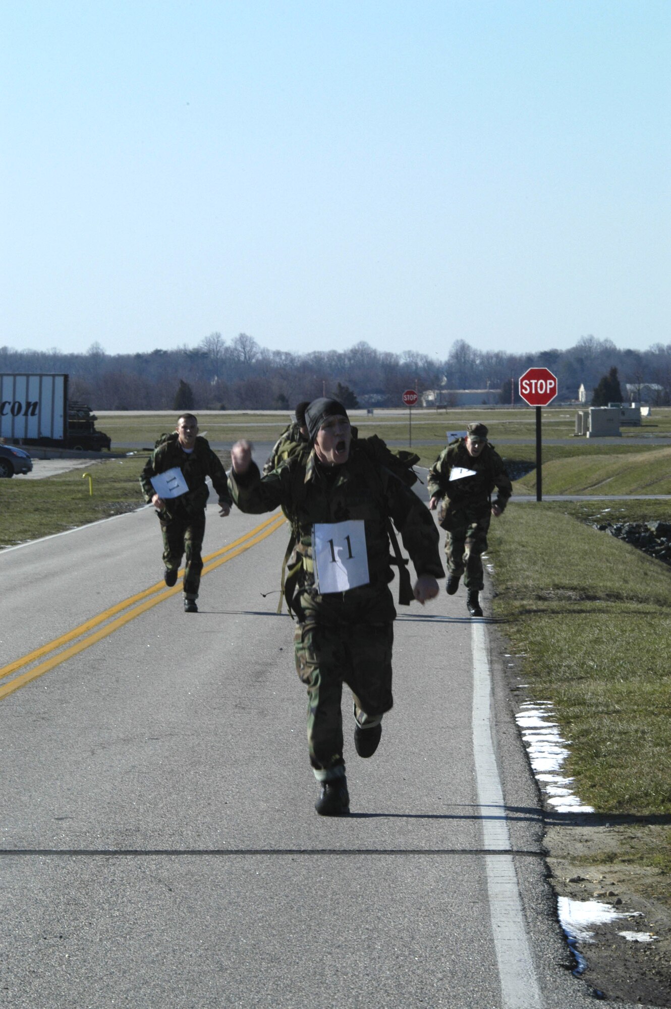 The 436th Security Forces Squadron's Team 11 is first to cross the finish line during the SFS's 8th Annual Ruck March at the Air Mobility Command Museum Jan. 27. The winning team members were: Senior Airmen Josh Hartzell (front), Dustin McPhillips, and Brett Williamson and Staff Sgt. Joseph Sedia (U.S. Air Force photo/ Staff Sgt. James Wilkinson)