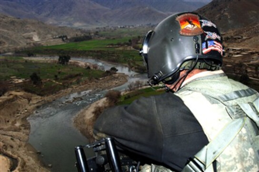 CH-47 Chinook helicopters from Combined Joint Task Force 76 carry troops and supplies over the rugged mountains of eastern Afghanistan, Jan. 26, 2007. Farmers and cattlemen eke out a living in the river valleys.