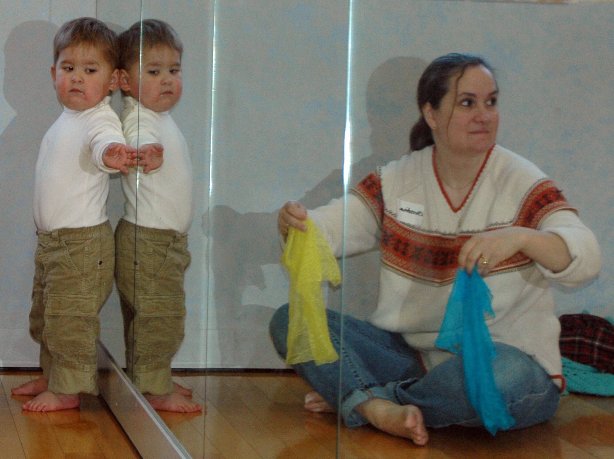 YOKOTA AIR BASE, Japan -- A mother and son team use scarves and mirrors to entertain themselves while music plays in the background. (U.S. Air Force photo by Jennifer Hensley)