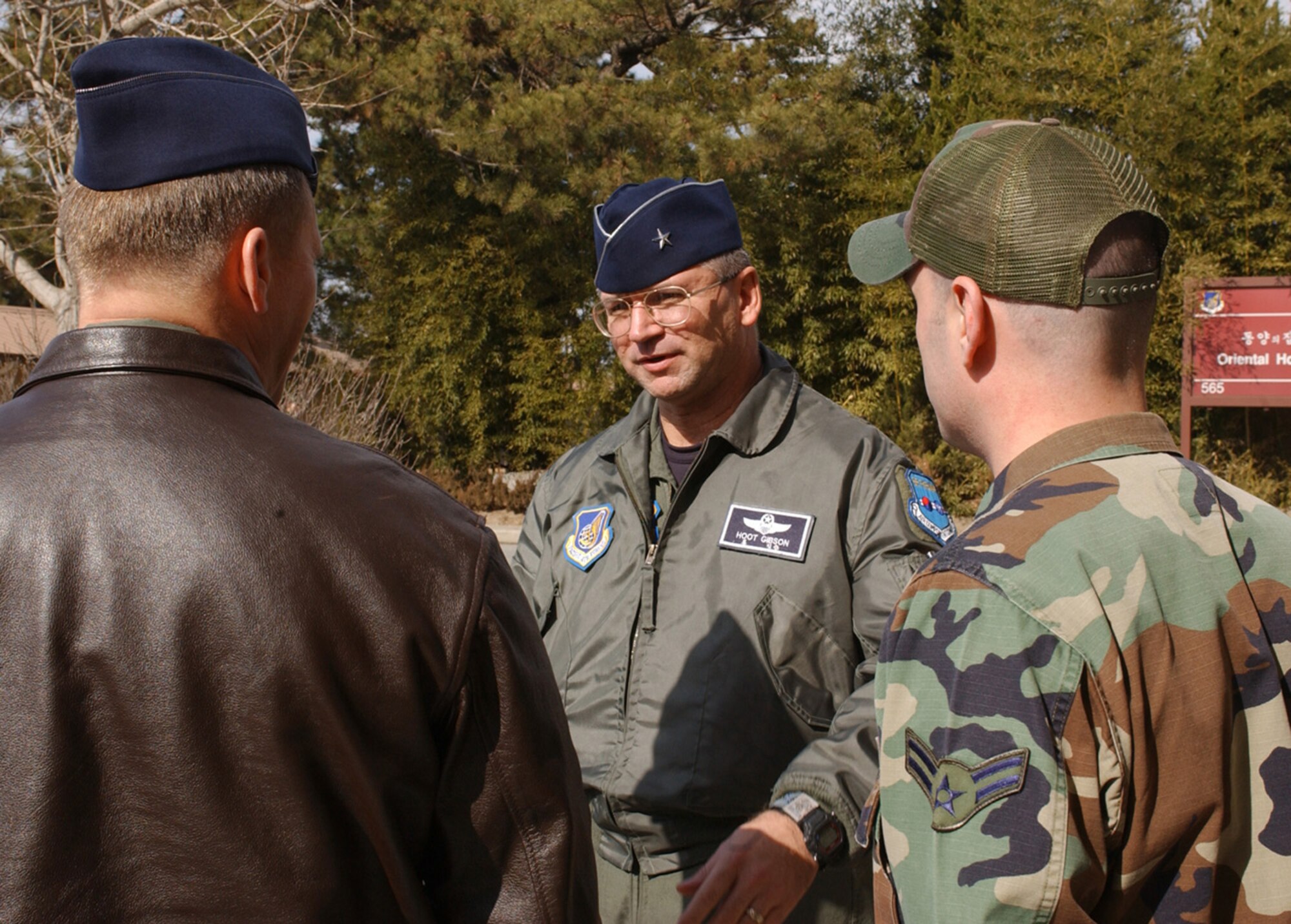 KUNSAN AIR BASE, Republic of Korea Jan. 30, 2007 -- Brig. Gen. Marke Gibson, Seventh Air Force vice commander, learns about the Wolf's ACE In The Hole non-alcoholic lounge Jan. 30 from Col. Jeff "Wolf" Lofgren and Airman 1st Class Cory Boatwright. This was Gen. Gibson's first look at the Wolf Pack mission and the completed bed down of F-117 Nighthawk Follow-on Forces from Holloman Air Force Base, N.M. Col. Lofgren is commander of the 8th Fighter Wing "Wolf Pack."(Air Force photo by Senior Airman Darnell Cannady)