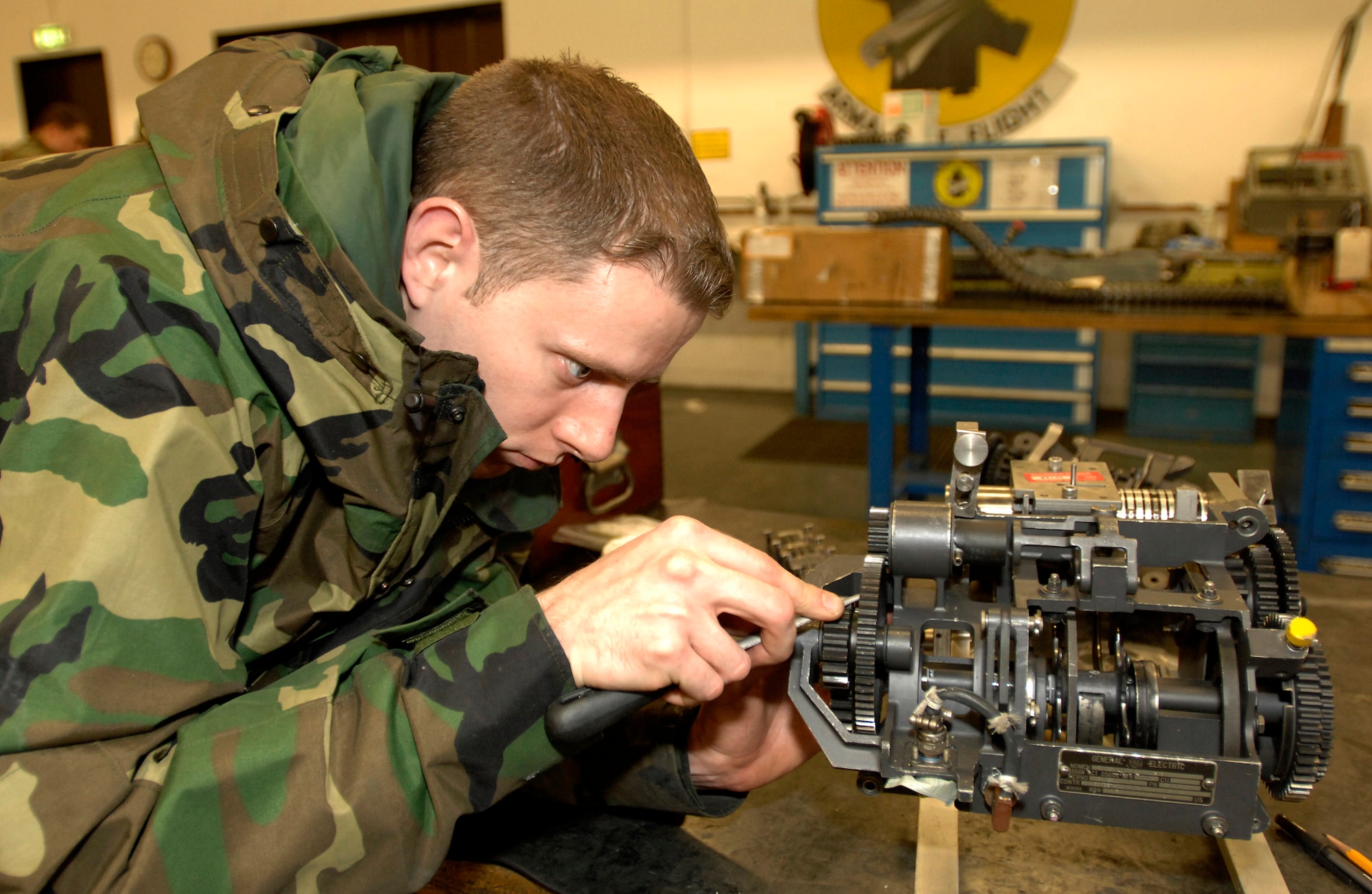 Staff Sgt Tony Simper works on an F-16 Fighting Falcon gun system Feb. 6 at Aviano Air Base, Italy. Sergeant Simper is an aircraft armament system craftsman with the 31st Maintenance Squadron Armament Flight. The flight is responsible for the maintenance of F-16 weapons systems. (U.S. Air Force photo/Airman 1st Class Liliana Moreno) 
