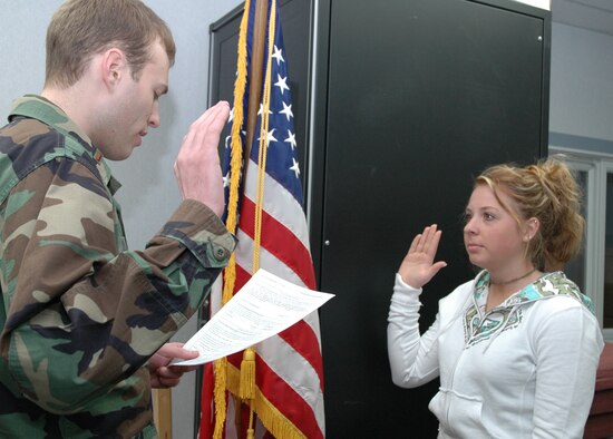 YOUNGSTOWN AIR RESERVE STATION, Ohio—Jackie L. Julian takes the oath of enlistment from her second cousin, Air Force 2nd Lt. Alan M. Julian, a financial management officer with the 910th Airlift Wing here on Feb. 6, 2007. This enlistment was extra special because it was also Lt. Julian's first swearing-in ceremony. Miss Julian, a student at Laurel High School, New Castle, Pa. and a native of Ellwood City, Pa.,  will work in aviation management for the Air Force Reserve. U.S. Air Force photo/Senior Airman Ann Wilkins Jefferson 
