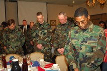 MINOT AIR FORCE BASE, N.D. -- Airmen bow their heads for a moment of silence during the base’s annual national prayer event at the Jimmy Doolittle Center here Feb. 2.  Hundreds of Team Minot members gathered to hear keynote speaker Chaplain (Maj. Gen.) Charles Baldwin, Air Force chief of chaplains. (U.S. Air Force photo by Airman 1st Class Sharida Bishop)