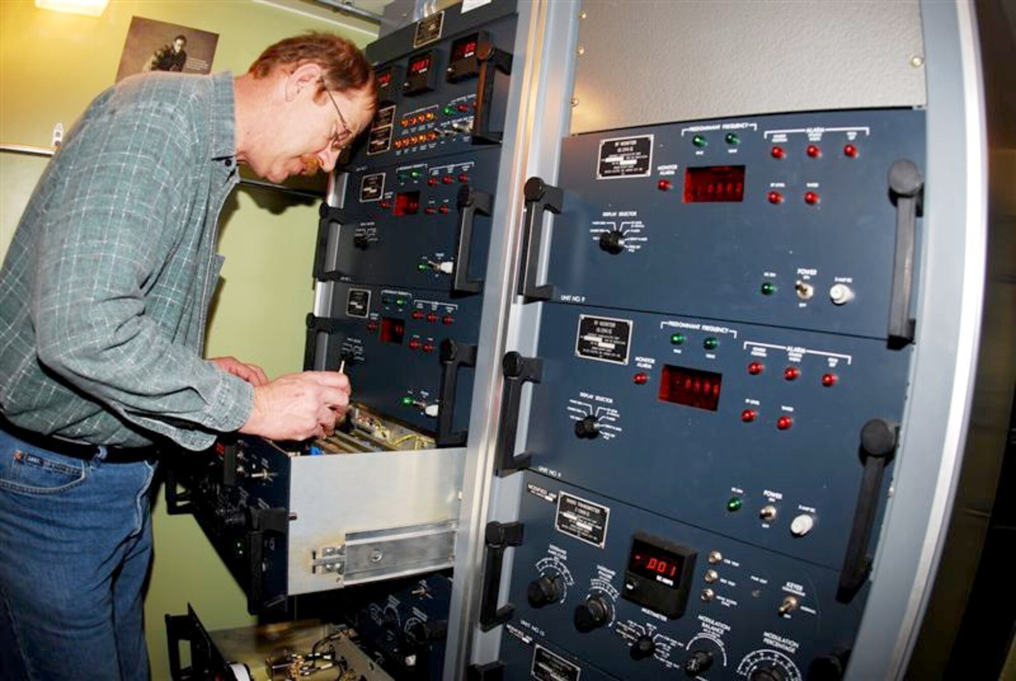 GRISSOM AIR RESERVE BASE, Ind., -- Joe Finnerty, an air traffic control and landing systems technician, adjusts an instrument landing transmitter at Grissom Air Reserve Base. The system provides runway center line and glide path data to landing aircraft. This information is received by the aircraft and is displayed as a visual indication enabling the pilot to maintain the proper runway centerline and glide path until visual contact is made with the runway. (U.S. Air Force photo/Master Sgt. Steve Robertson)