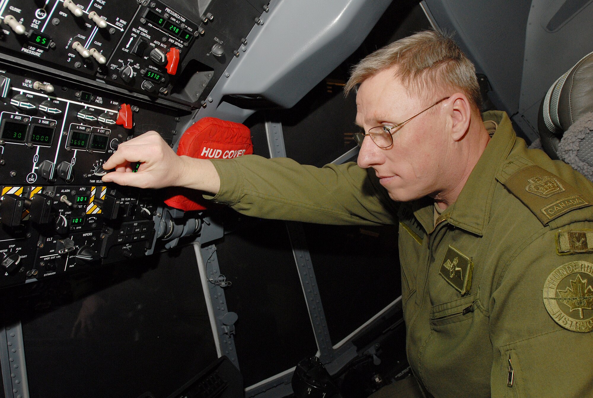 Canadian Warrant Officer Blair Smith examines a C-130J flight instruments on a maintenance training tool at Little Rock Air Force Base, Ark.,  Jan. 30, 2007.  Canadian air force representatives recently visited the base to view C-130J operations and training procedures in preparation for the purchase of C-130J's in the near future. (U.S. Air Force photo by Airman 1st Class Nathan Allen) 