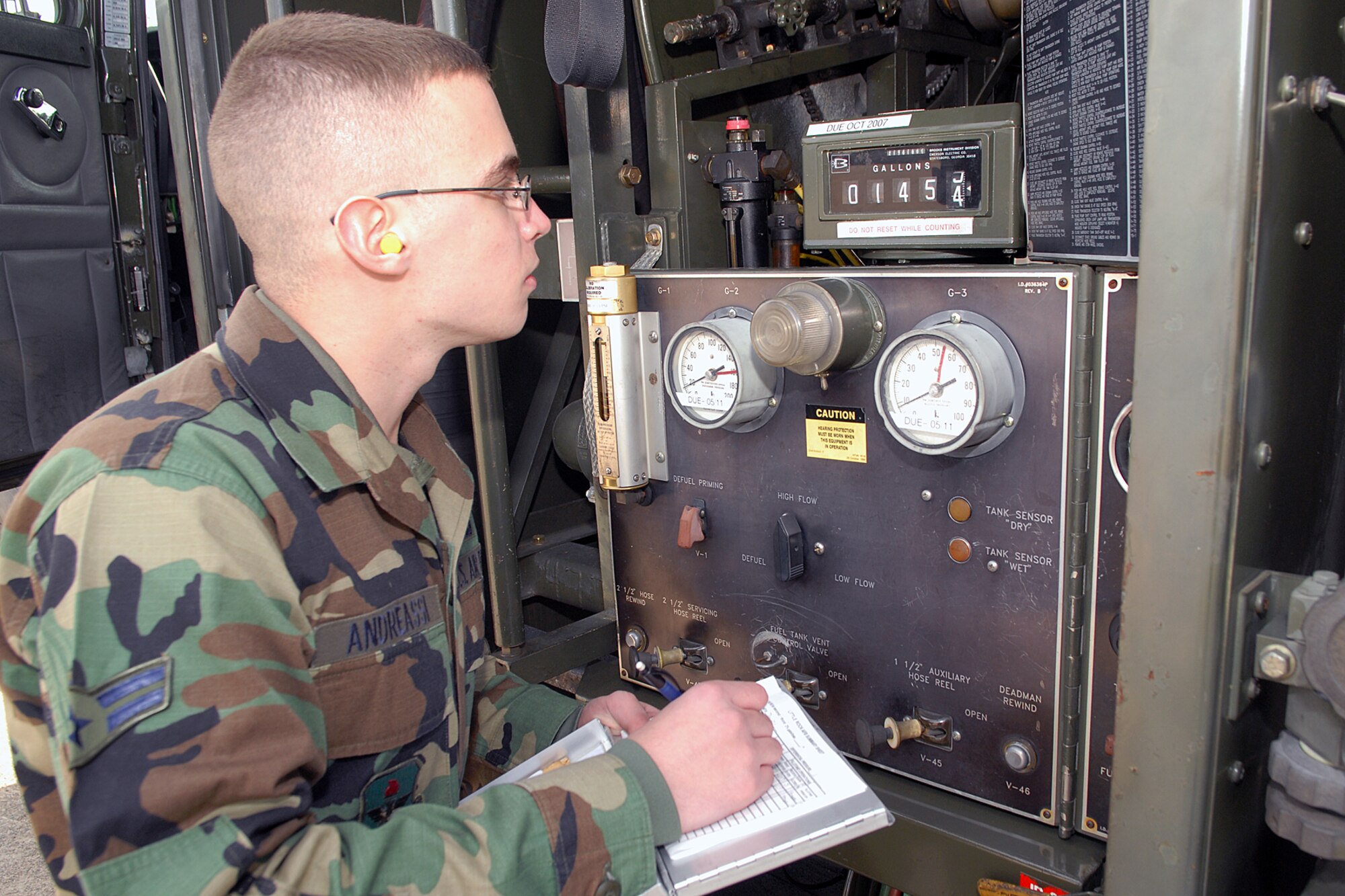 Airman First Class Alexander Andreassi, Fuel Distribution Operator, 314th Logistics Readiness Squadron, monitors the fuel volume control panel for fuel being pumped into an aircraft being refueled at Little Rock Air Force Base on Jan. 24, 2007. The Fuels Management Flight was recently presented the Roy Bateman Award as best fuels flight in Air Education and Training Command. (U.S. Air Force photo by Airman 1st Class Nathan Allen) 